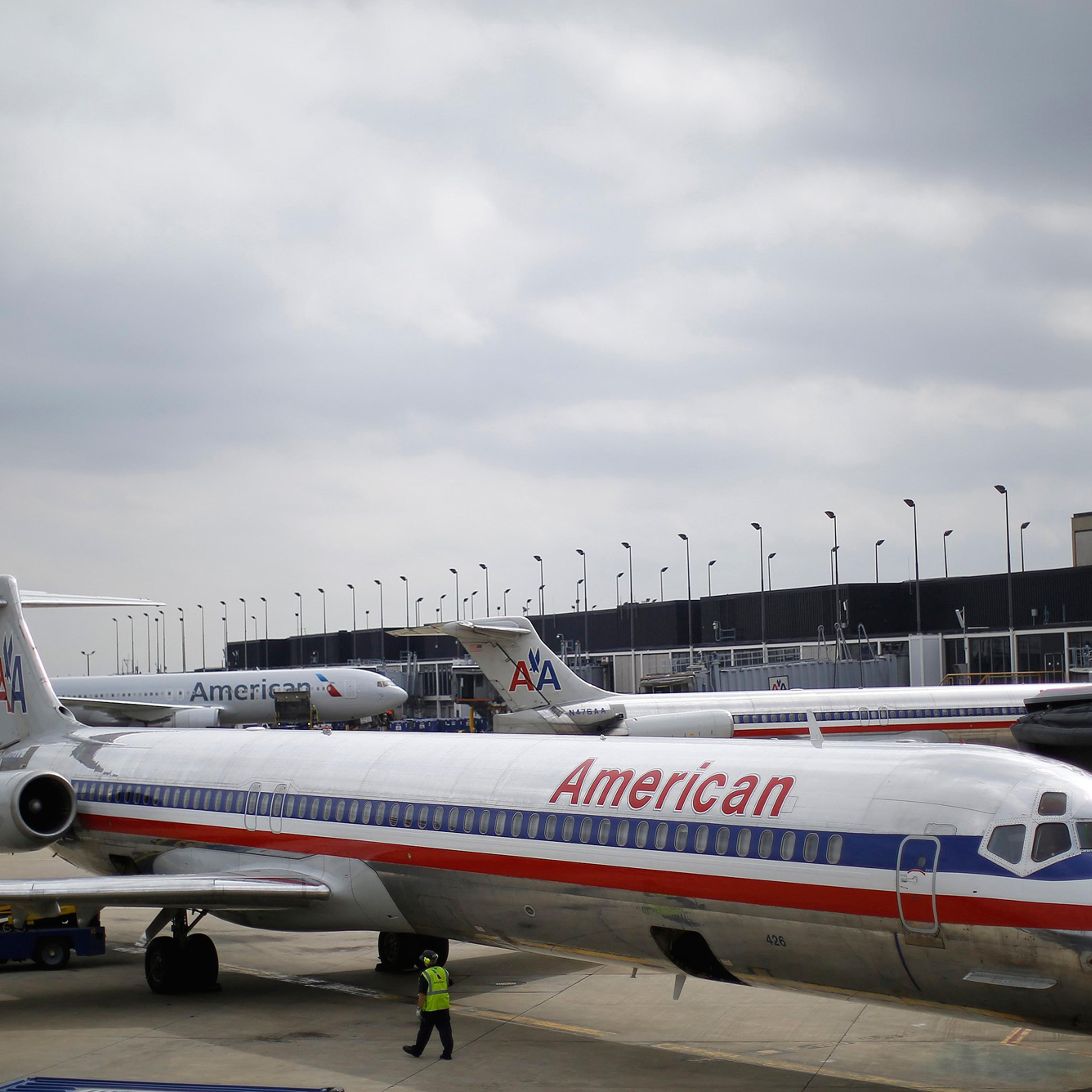 An American Airlines airplane sits at a gate at the O'Hare Airport in Chicago, Illinois