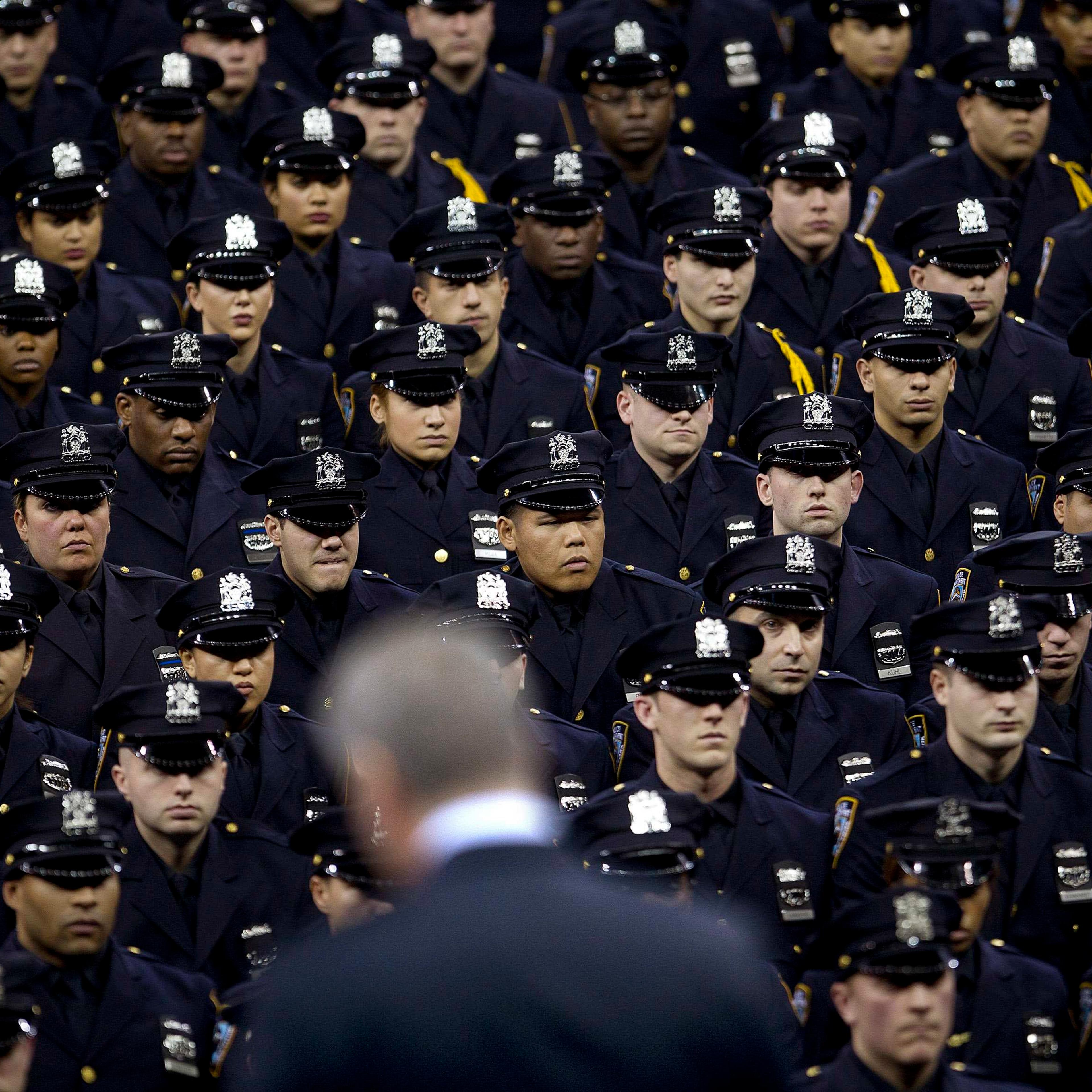 Blasio speaks from the podium to the New York City Police Academy Graduating class in New York