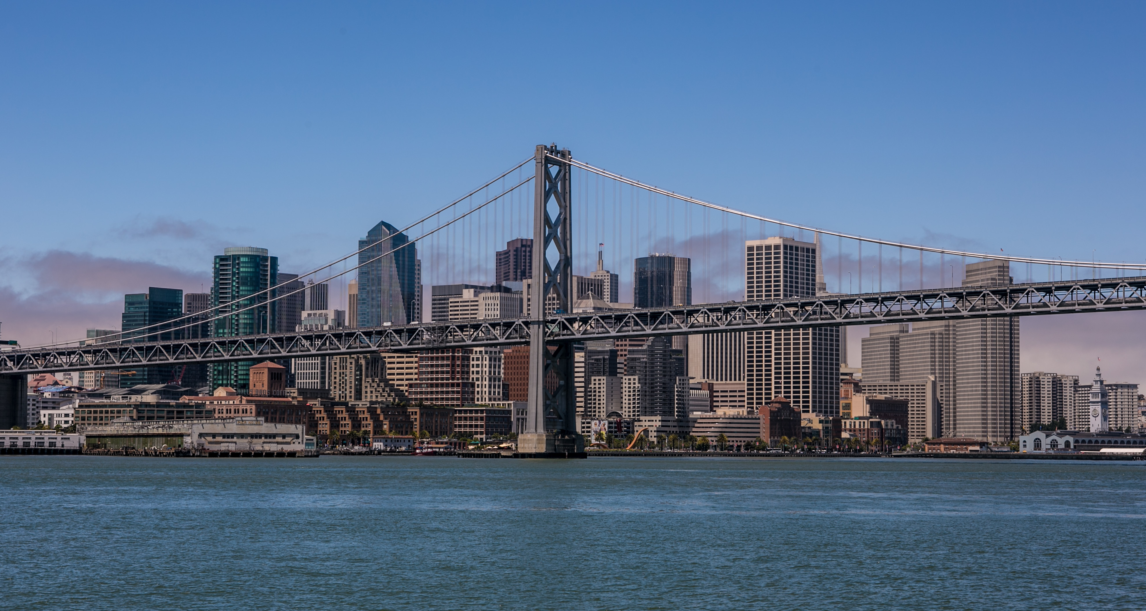 The downtown San Francisco skyline and Bay Bridge are shown during a 30-minute ferry ride across to AT&T Park on July 10, 2013, in San Francisco.