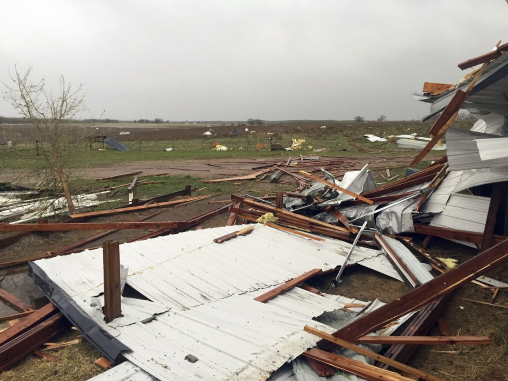 Debris lies scattered on the ground after a tornado was reported in Weld County outside Wiggins, Colo., May 7, 2016. Spring storms menaced parts of the West on Saturday, bringing hail and a tornado sighting in Colorado and deadly driving conditions in Ar