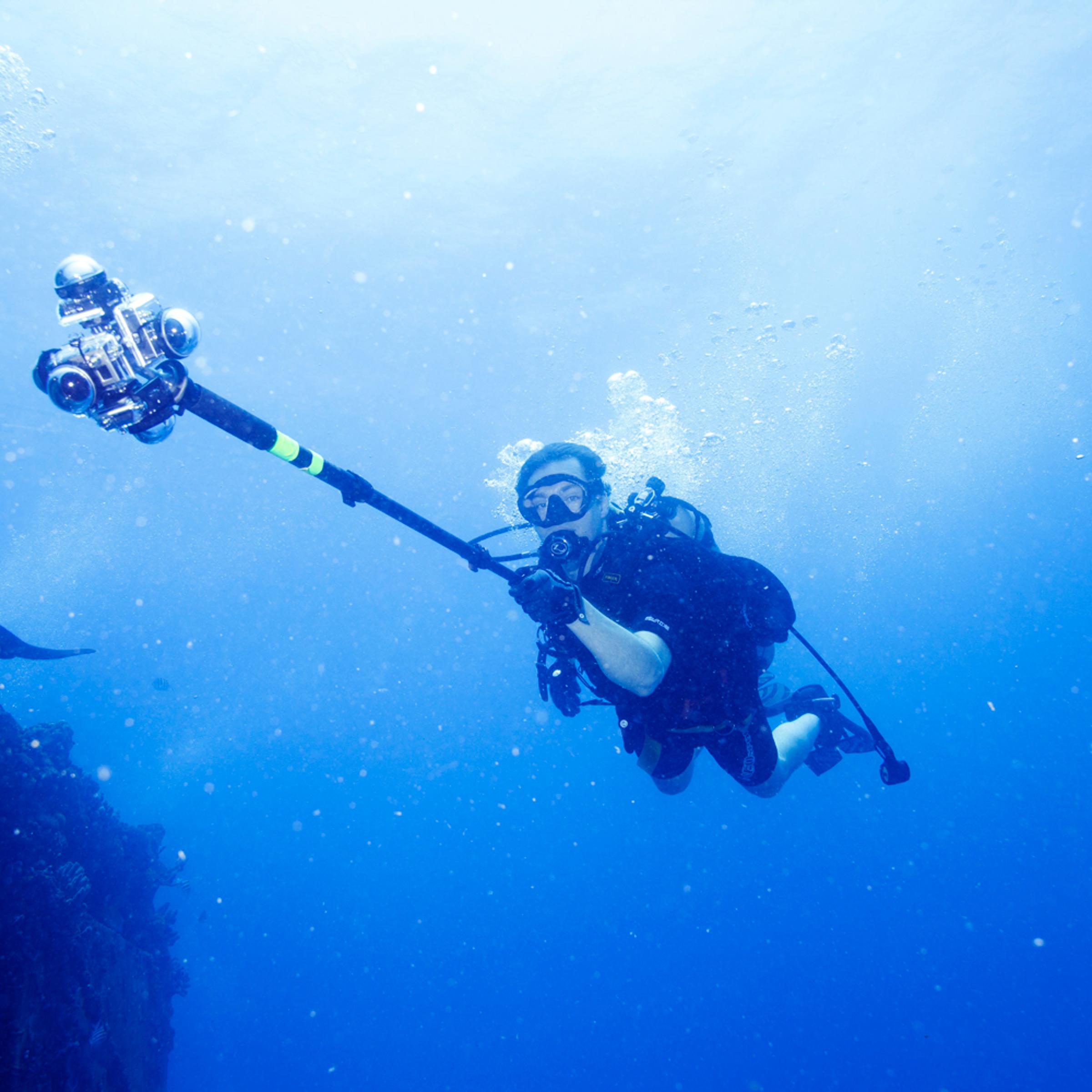 TIME Senior Editor Jonathan D. Woods is seen holding a 360Heros scuba rig as he shoots a 360 video of Aquarius Reef Base on June 15, 2014.
