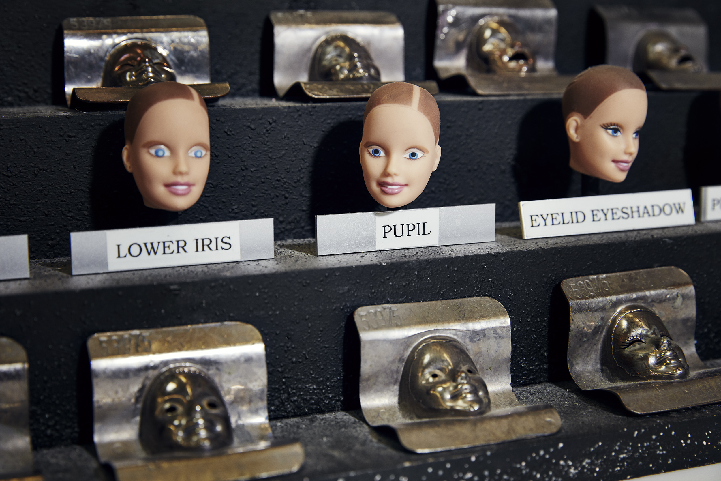Three stages of painting Barbie's eyes. 