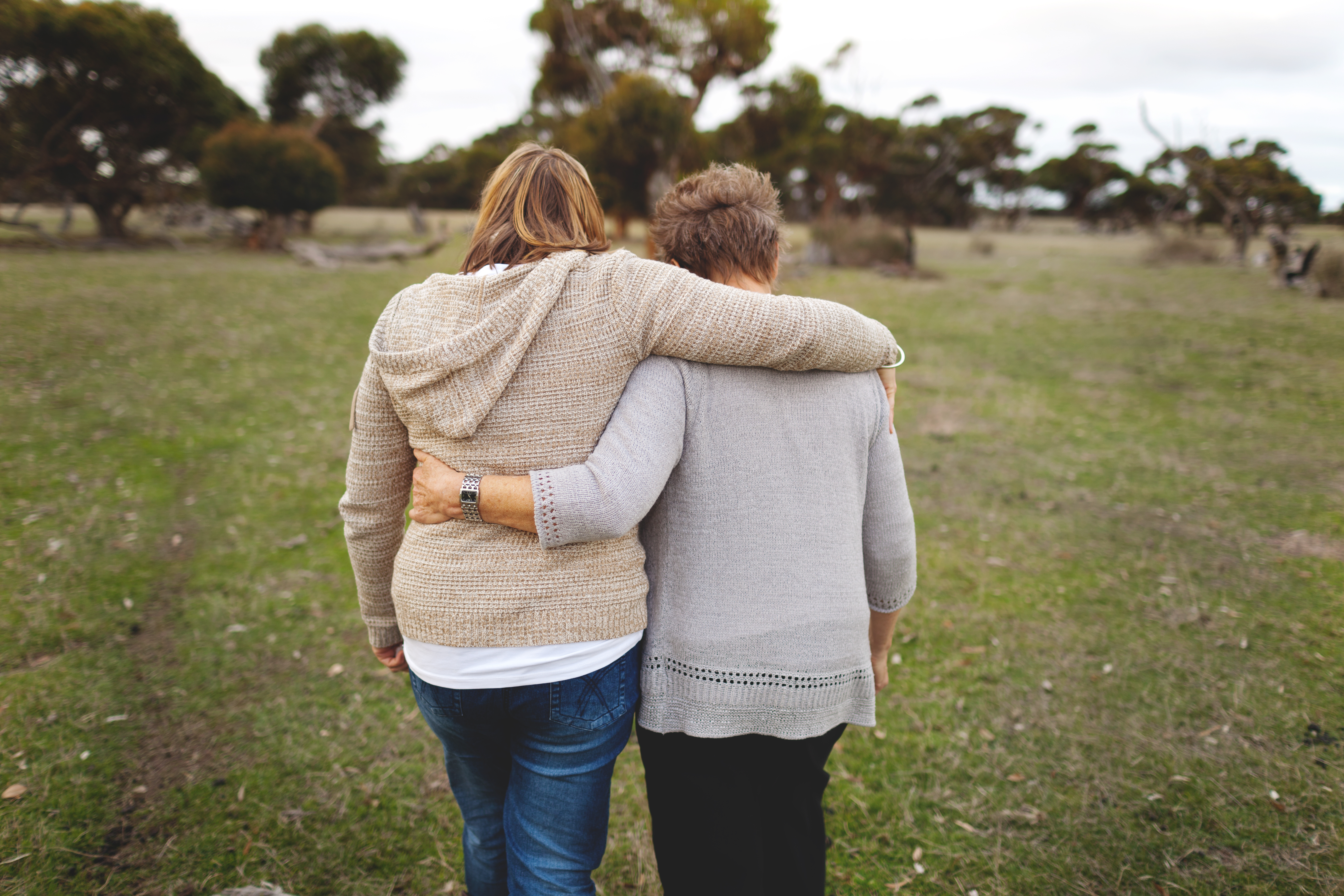 mother-daughter-walking-embracing
