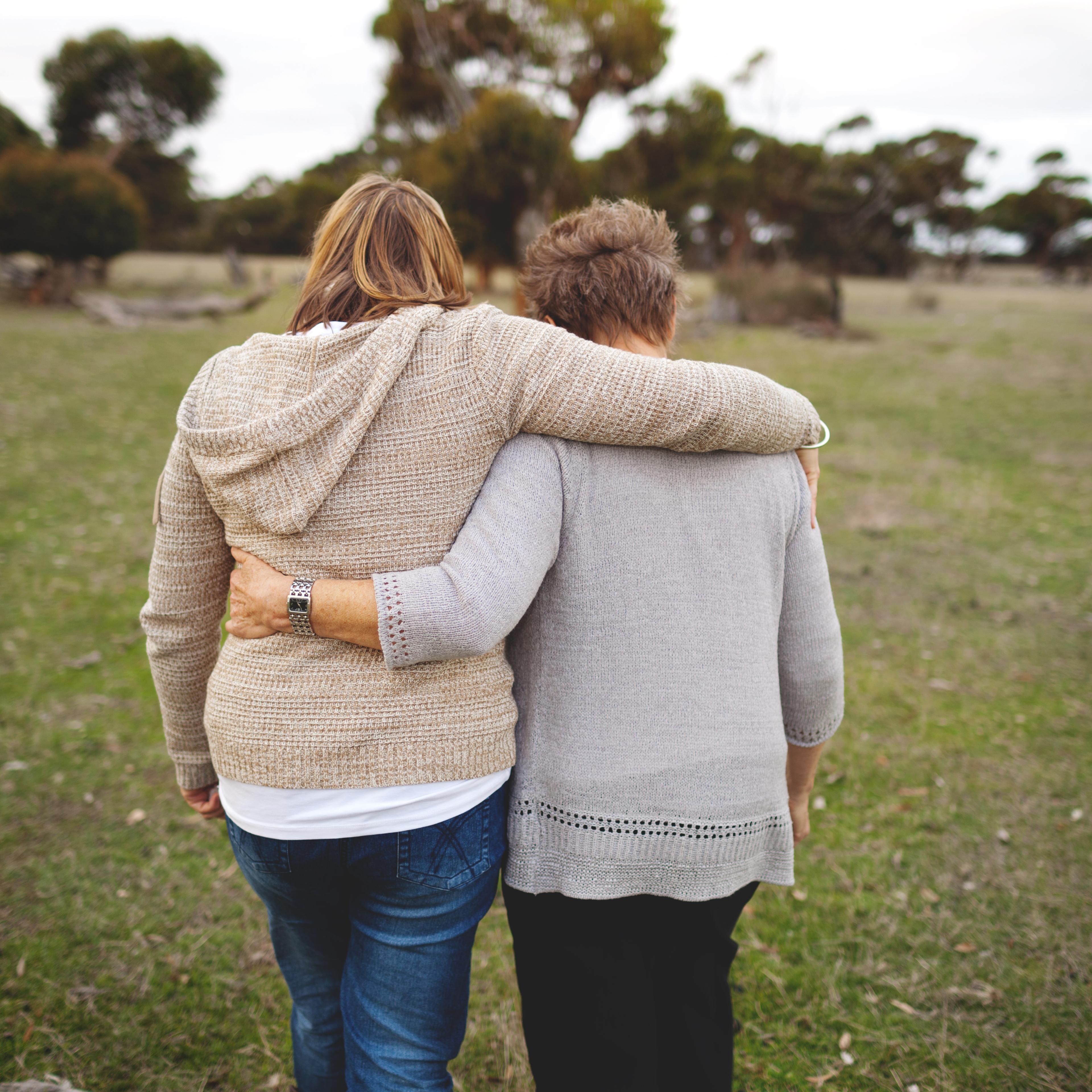 mother-daughter-walking-embracing
