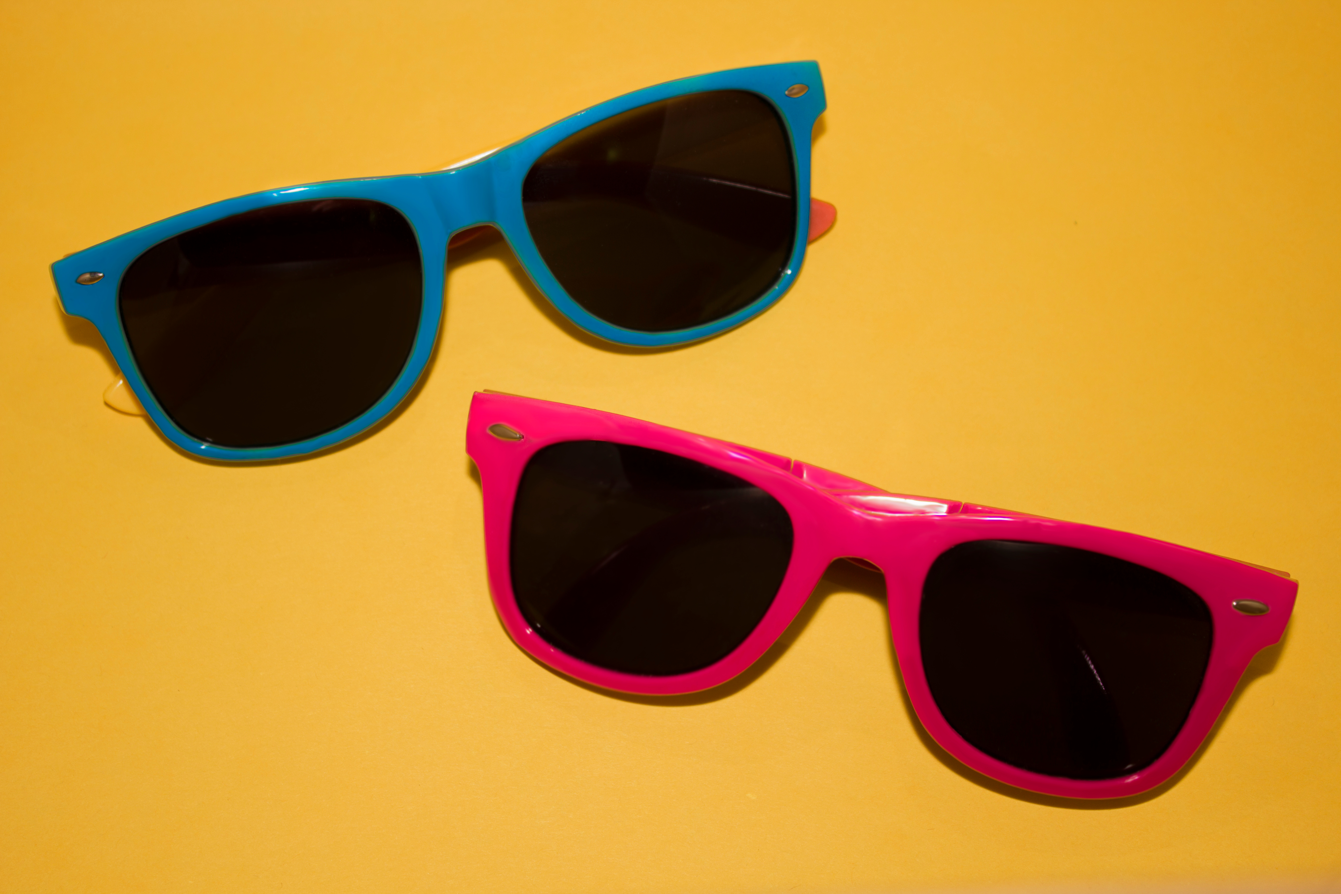 High Angle View Of Sunglasses On Yellow Table
