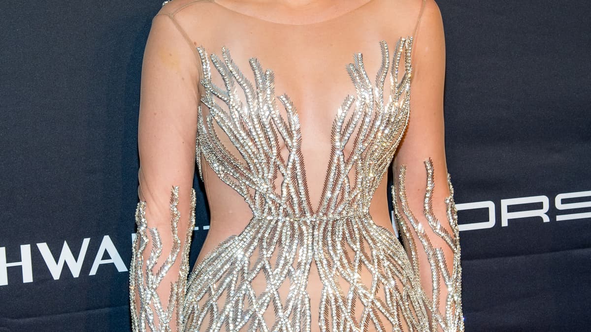 khloe kardashian silver dress Khloe Kardashian wore #DolceGabbana while out in Los Angeles. Khloe wore a custom crystal mesh dress with lace up details. Photography Ricardo Horacio #DGCelebs