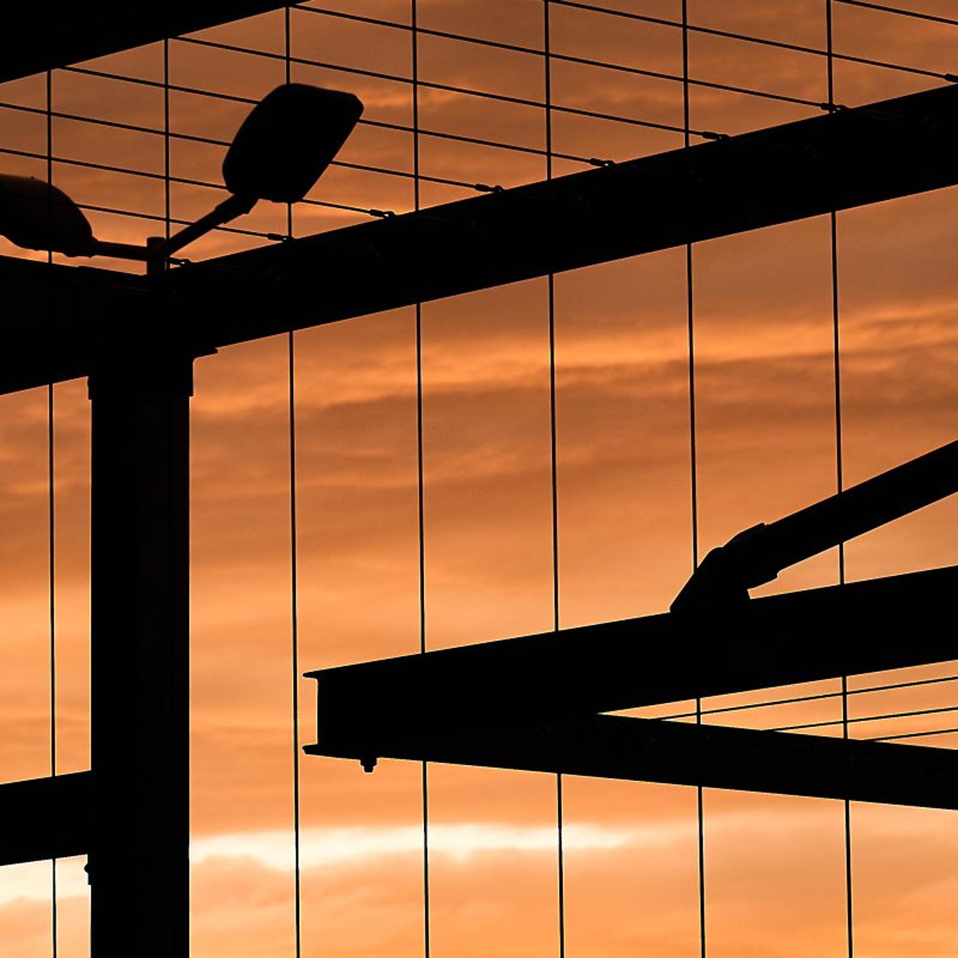 Photo of a prison gate at sunset.