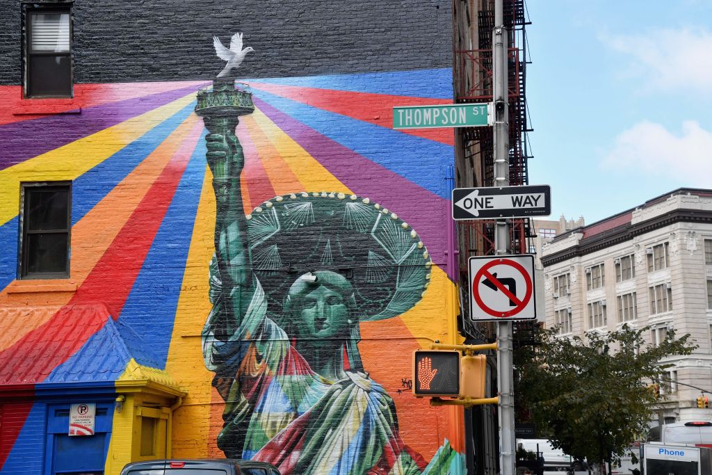 TOPSHOT-US-ART-IMMIGRATION-MURAL