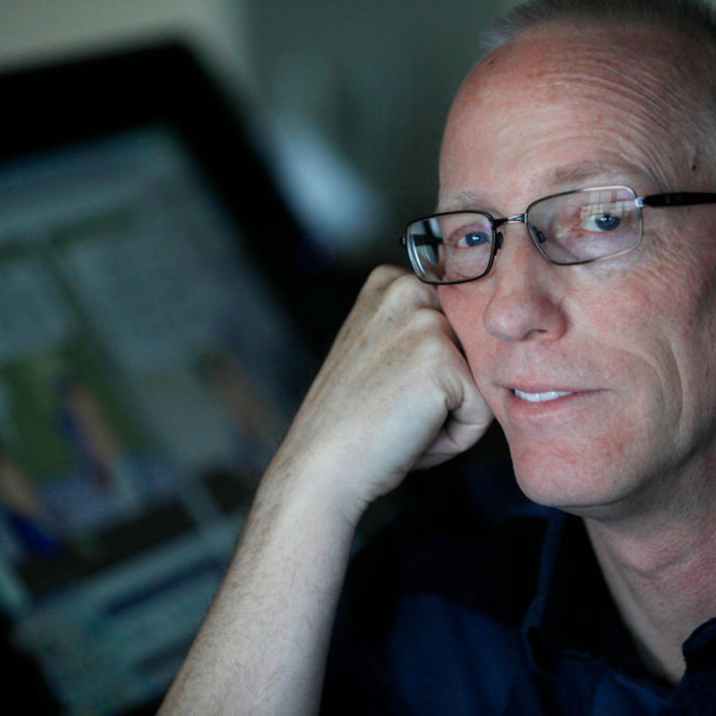 Scott Adams, cartoonist and author and creator of "Dilbert," poses for a portrait in his home office in Pleasanton, Calif. on Jan. 6, 2014.
