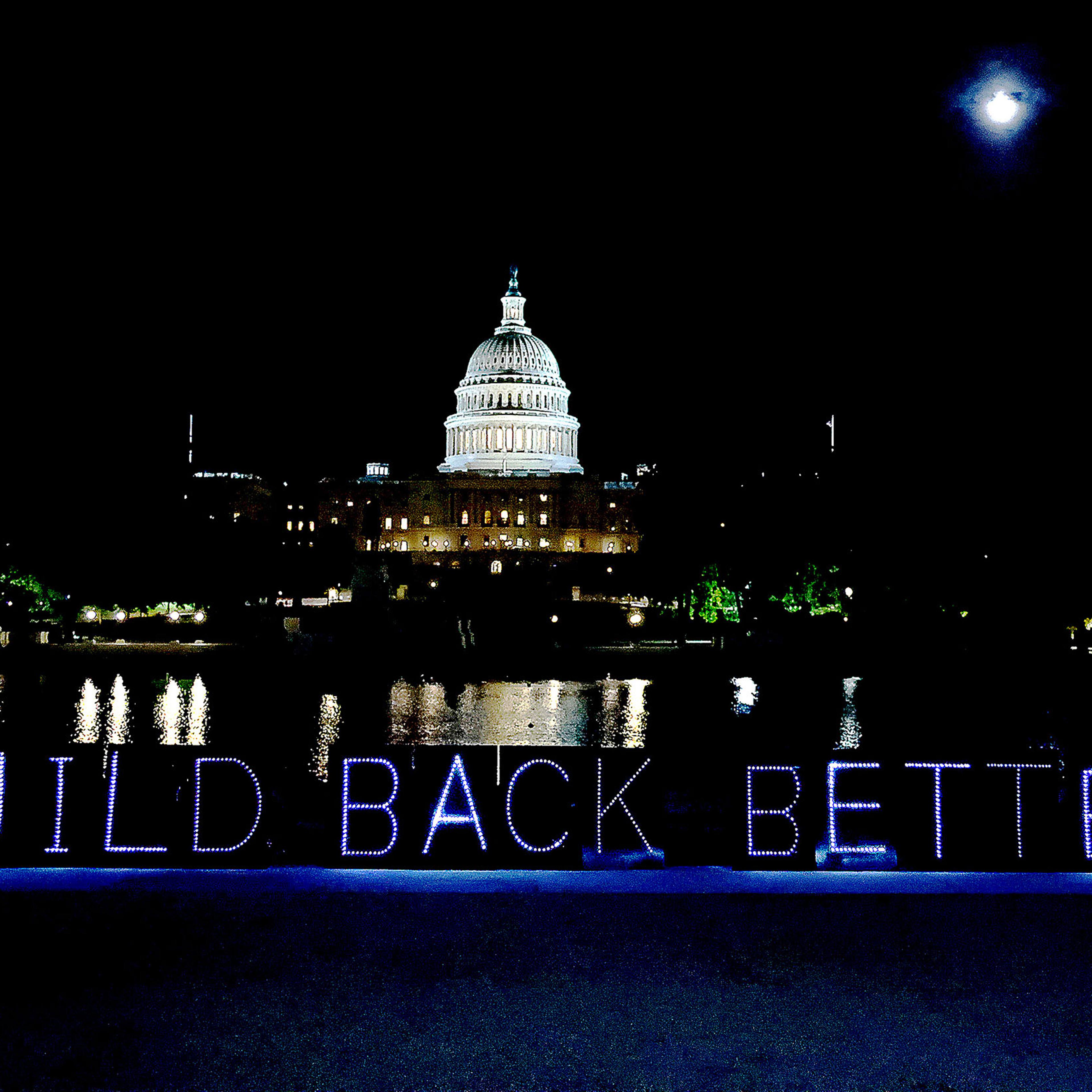 #CareCantWait light projection advocating for the passage of "Build Back Better" budget reconciliation outside of the Capitol in Washington, on Sept. 21, 2021