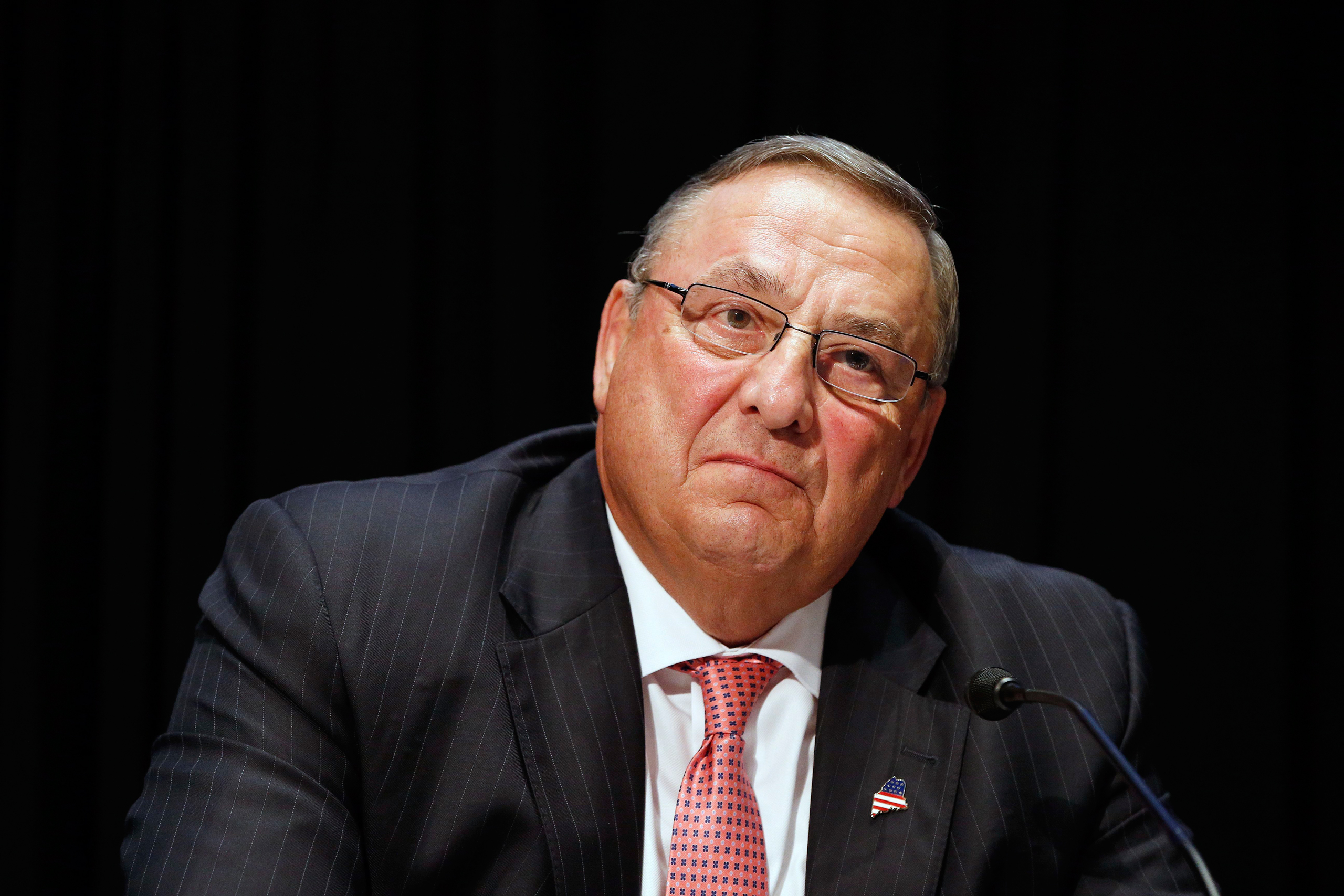 FILE- In this June 7, 2016, file photo, Maine Gov. Paul LePage attends an opioid abuse conference in Boston. LePage is being accused again of making racially insensitive comments, this time by saying photos he's collected in a binder of drug dealers arre