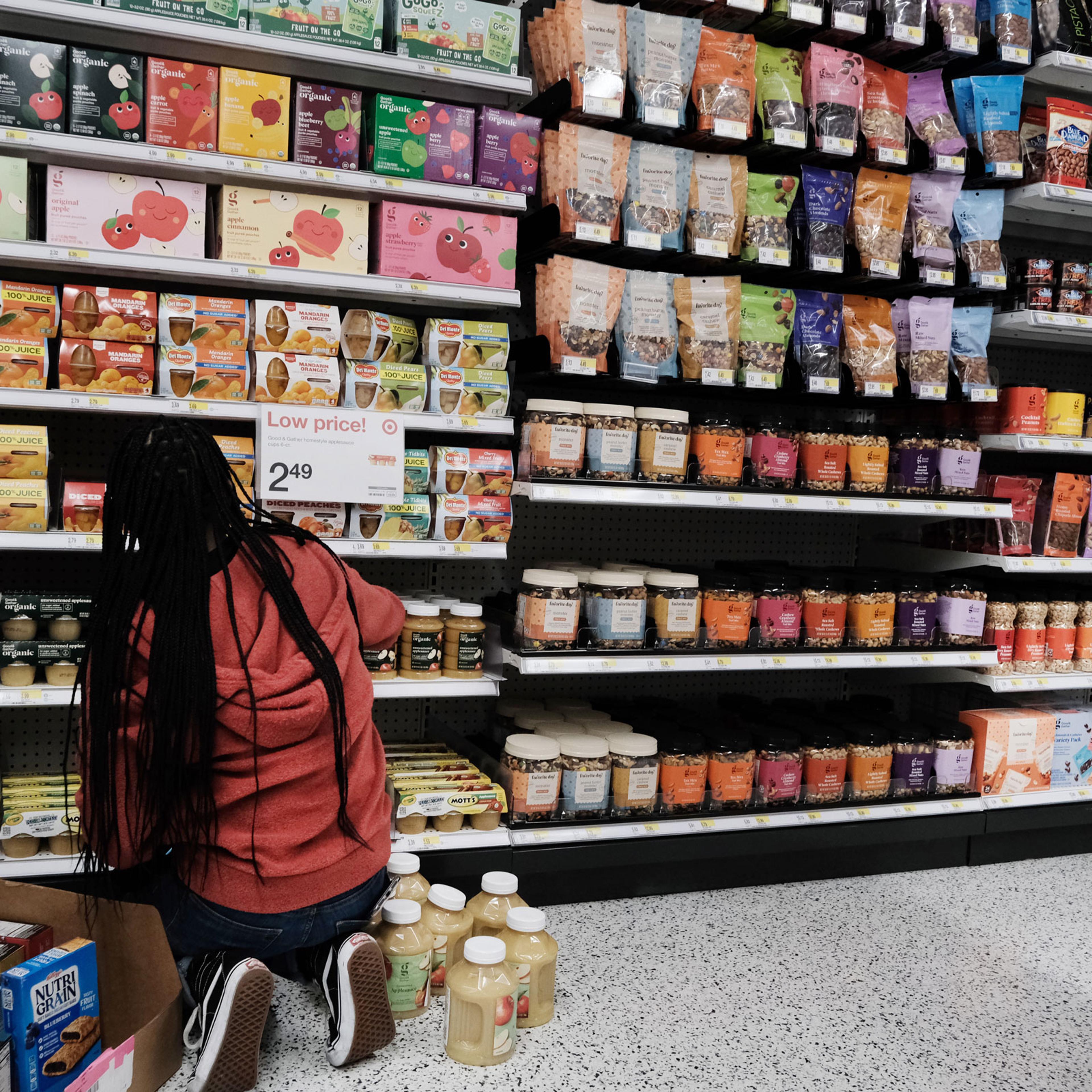 A woman stocks food at a Manhattan grocery store on Oct. 26, 2022 in New York City.