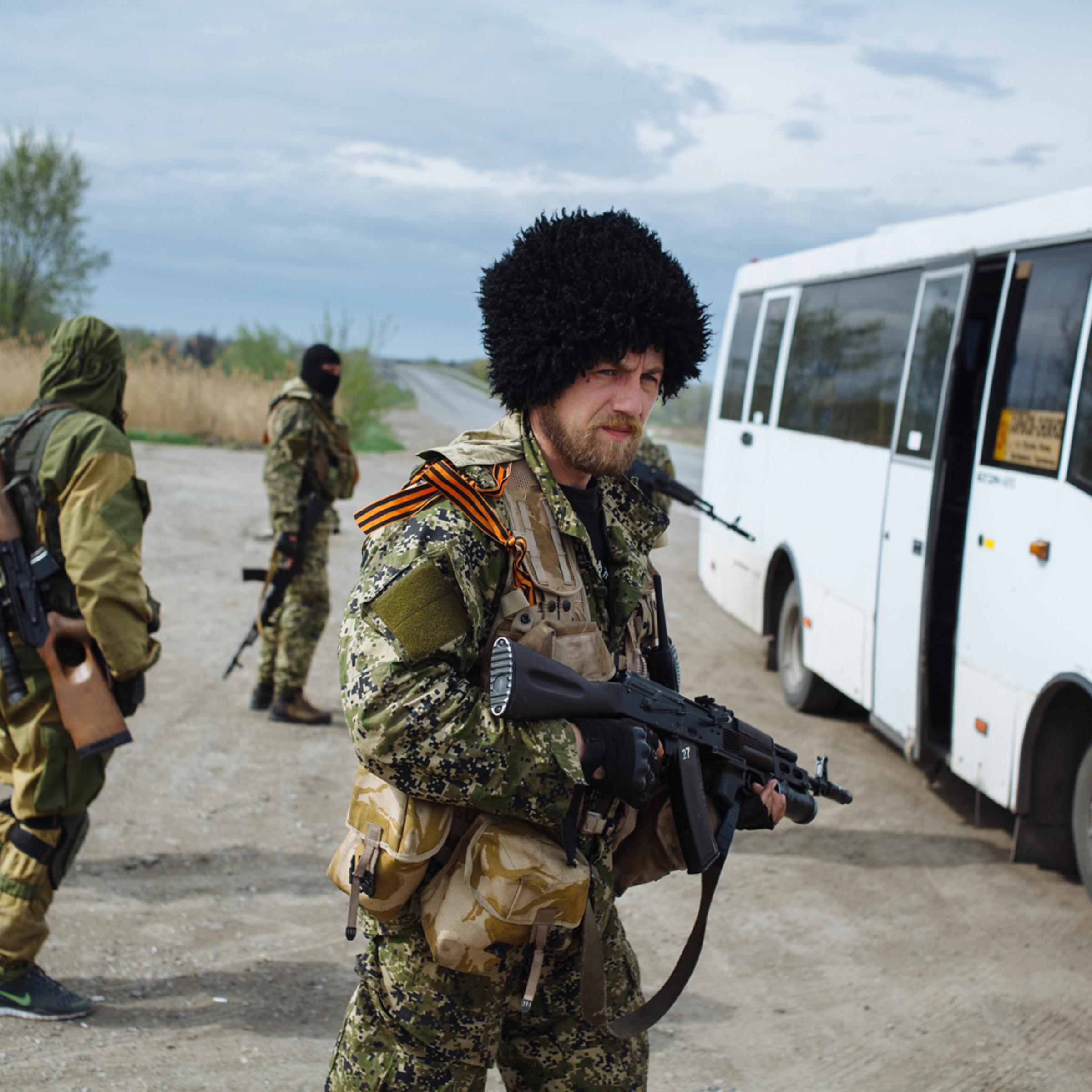 The Russian paramilitary group known as the Wolves' Hundred block the road near the checkpoint on the Kharkiv - Rostov-on-Don highway, April 20, near Slavyansk.