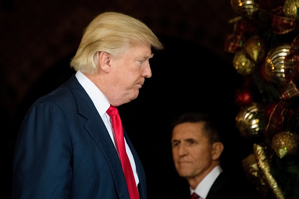 US President-elect Donald Trump (L) stands with Trump National Security Adviser Lt. General Michael Flynn (R) at Mar-a-Lago in Palm Beach, Florida, where he is holding meetings on December 21, 2016.