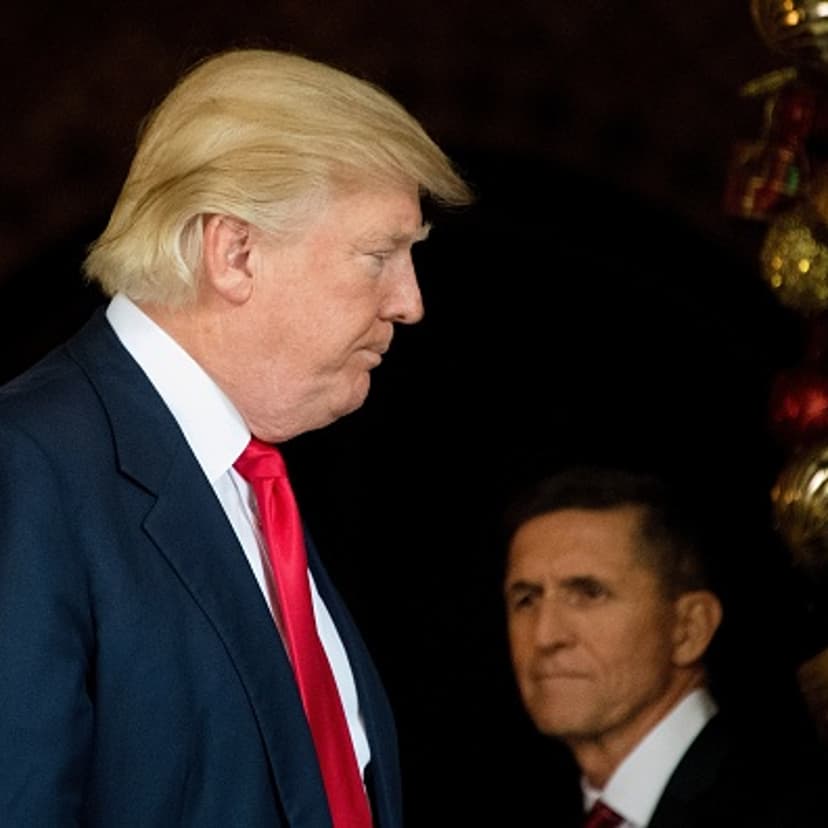 US President-elect Donald Trump (L) stands with Trump National Security Adviser Lt. General Michael Flynn (R) at Mar-a-Lago in Palm Beach, Florida, where he is holding meetings on December 21, 2016.