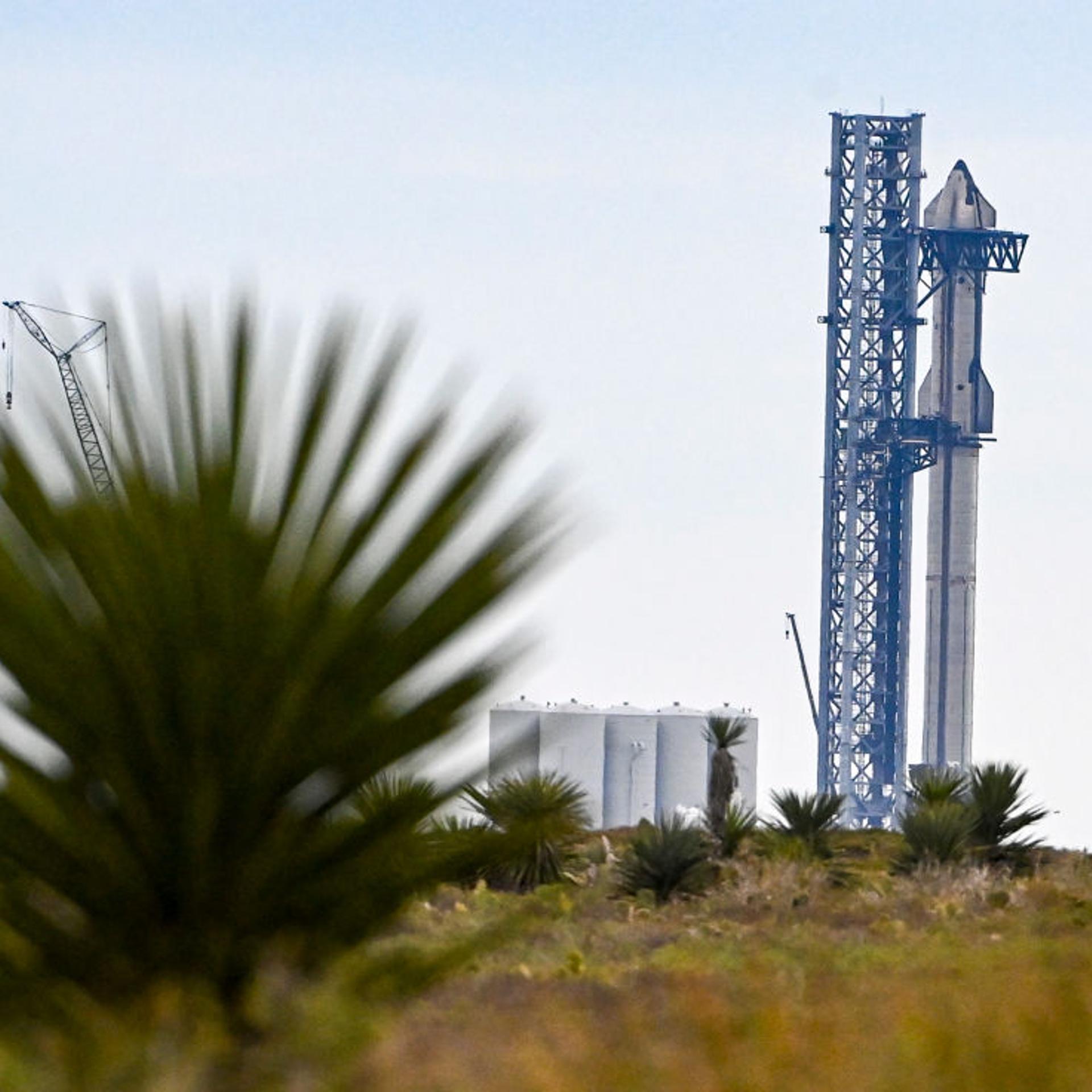 The SpaceX Starship spacecraft sits on a super Super Heavy rocket booster at the company's launch facility in south Texas on Feb. 10, 2022.