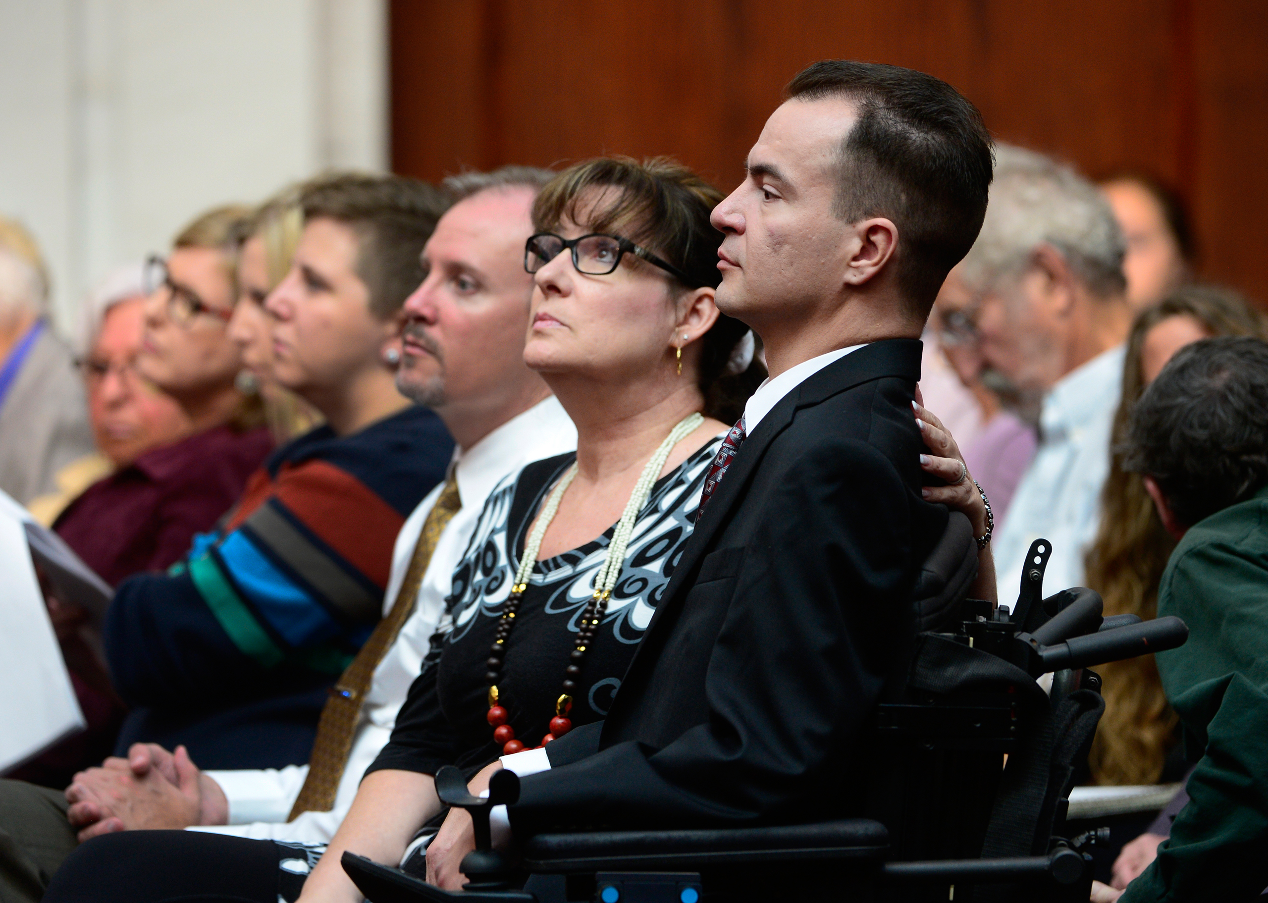 Brandon Coats, right, with his mother Donna Scharfenberg sitting by his side, Sept. 30, 2014.