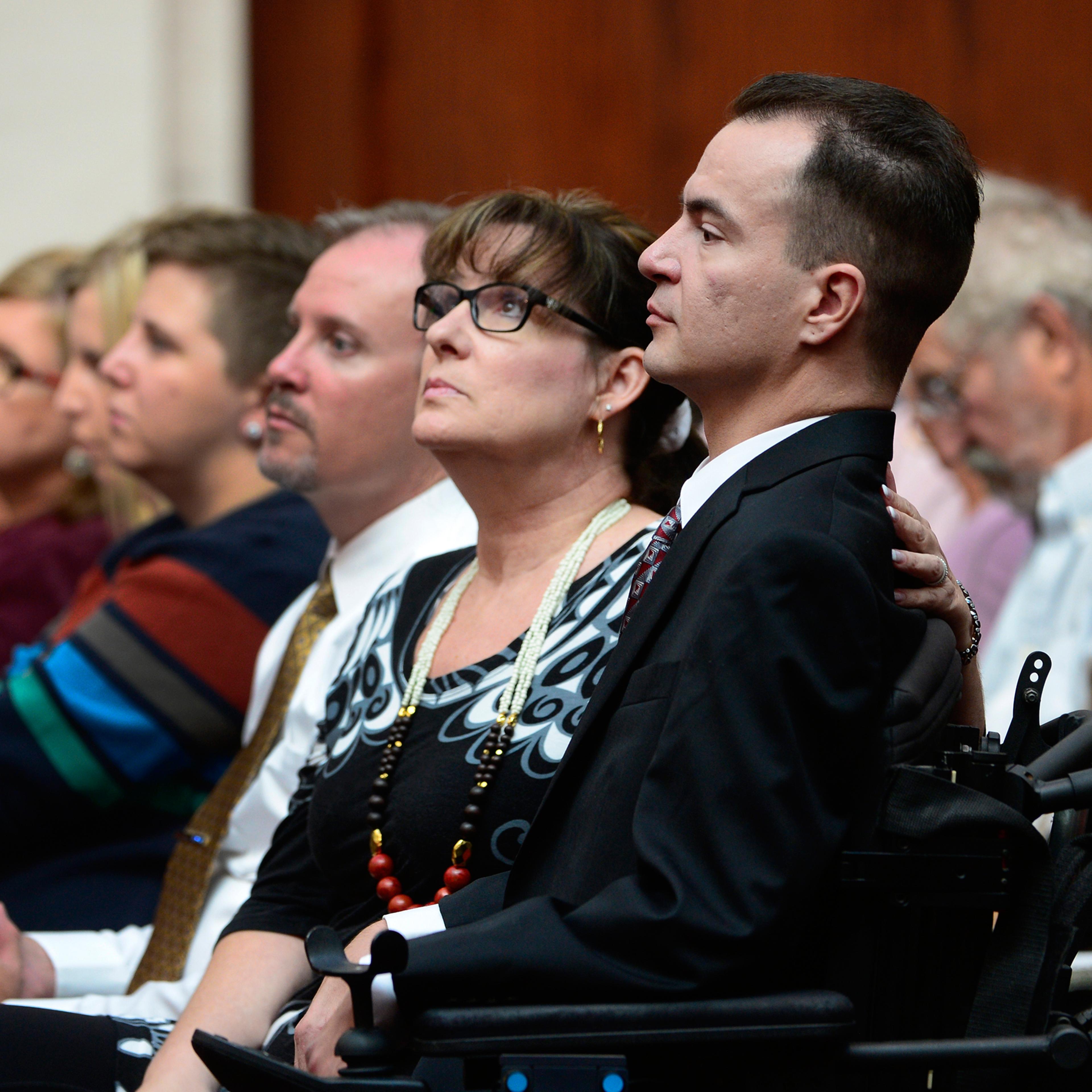 Brandon Coats, right, with his mother Donna Scharfenberg sitting by his side, Sept. 30, 2014.
