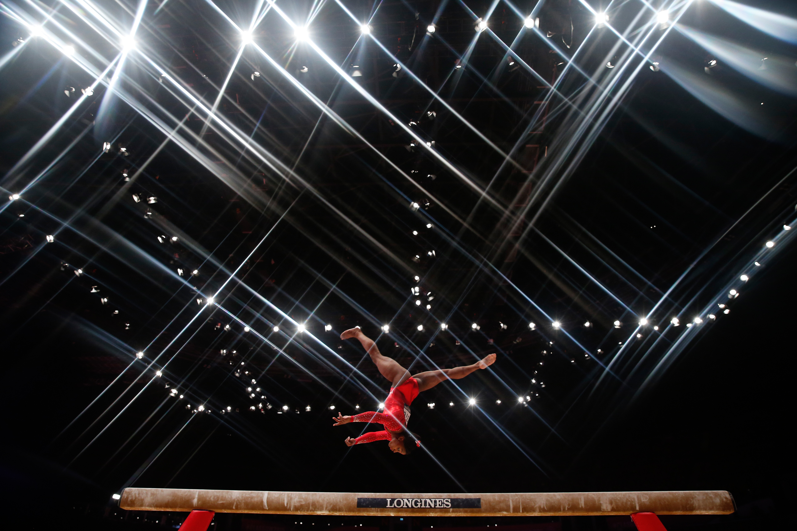 Simone Biles of the U.S competes on the beam during the women's all-round final at the World Gymnastics Championships in Glasgow