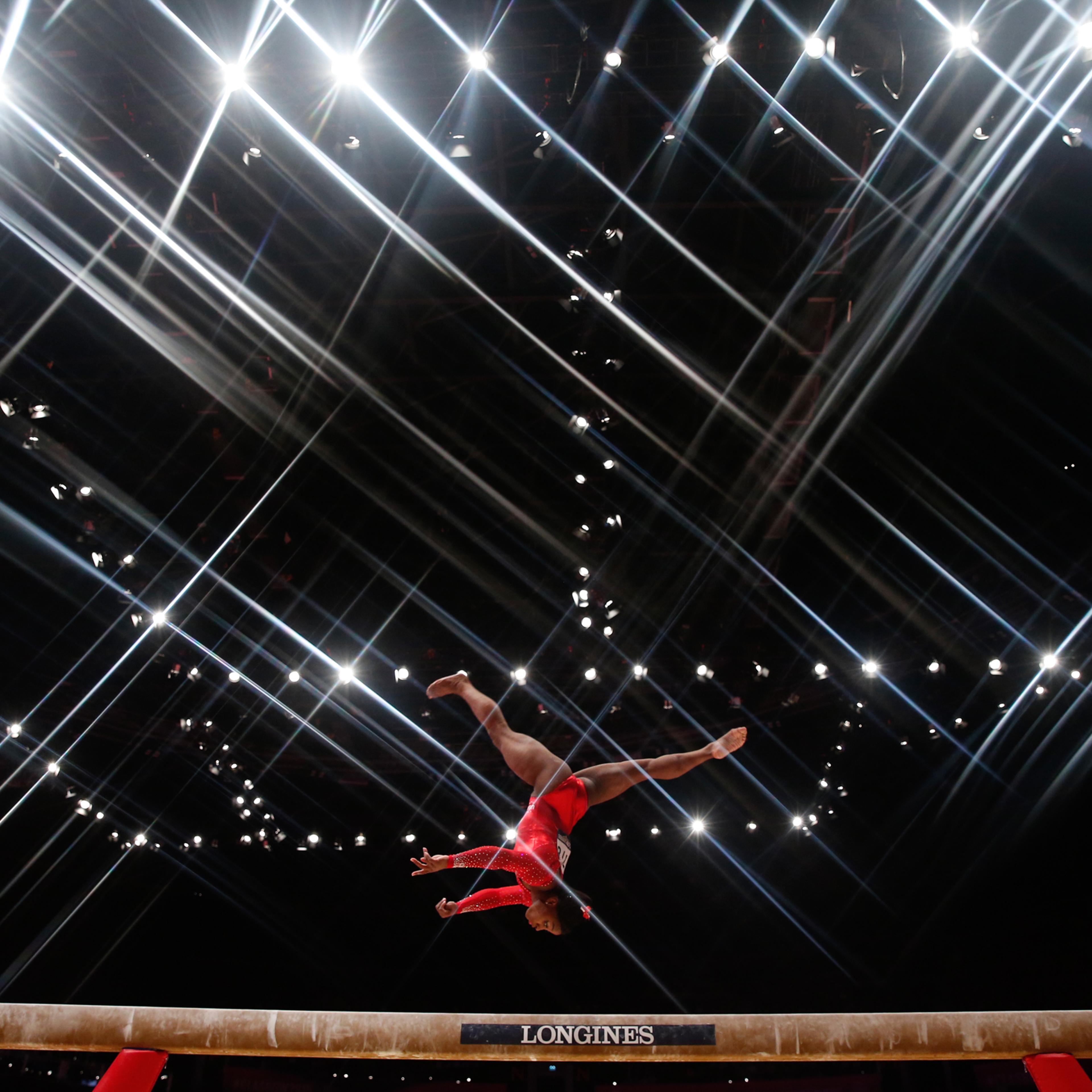 Simone Biles of the U.S competes on the beam during the women's all-round final at the World Gymnastics Championships in Glasgow