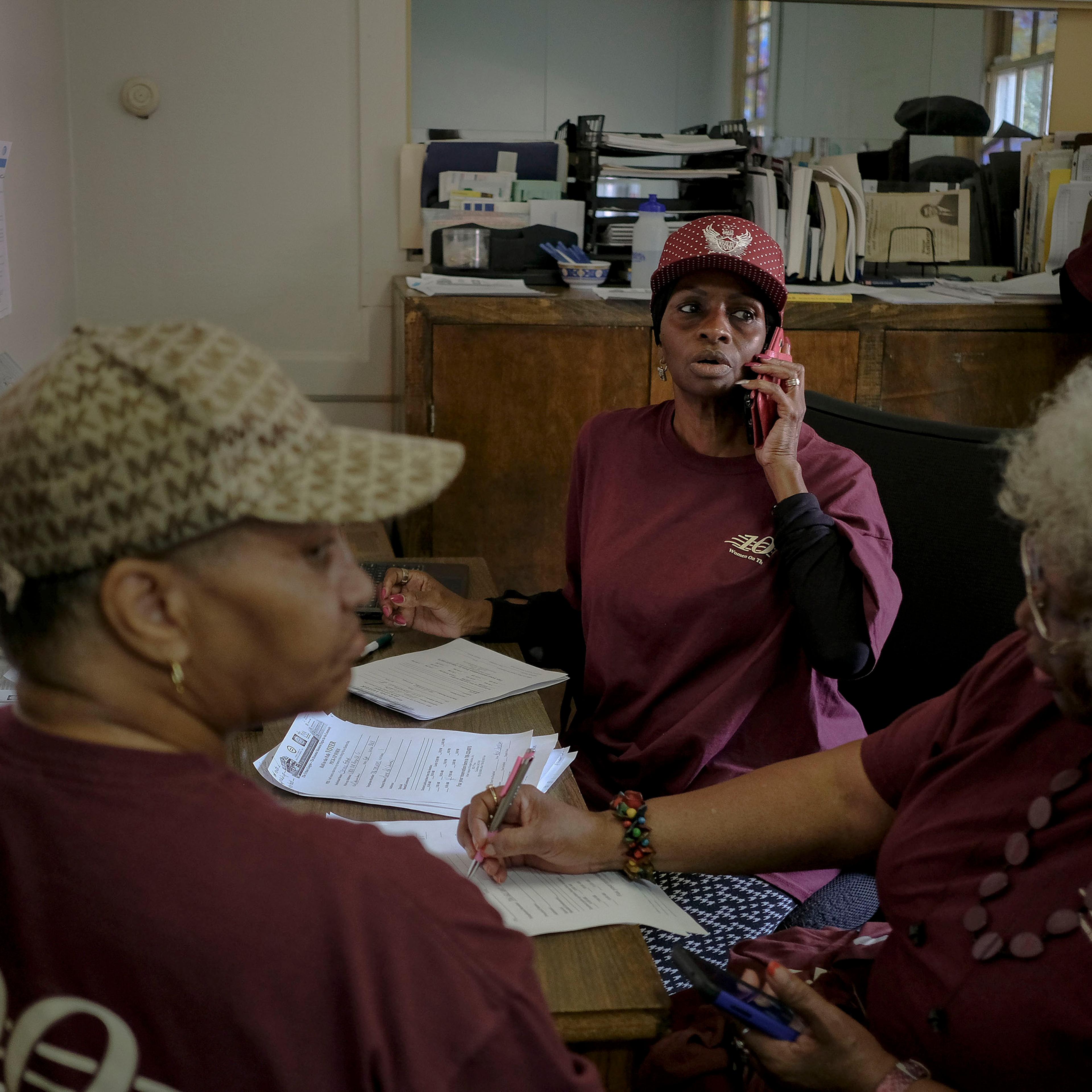 Members of Women on the Move confirm registration and polling precincts with callers at the Urban League of Greater Columbus in Columbus, Ga. on election day, Nov. 6, 2018.