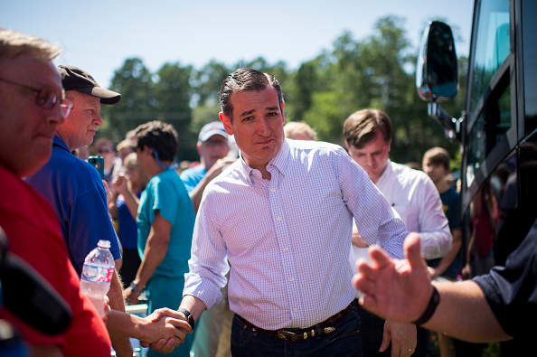 Presidential candidate Sen. Ted Cruz (R-TX) shakes hands with supporters as he emerges from the Cruz campaign bus for a rally in a field behind Sprayberry's BBQ in Newnan, Ga., on Saturday, Aug. 8, 2015.