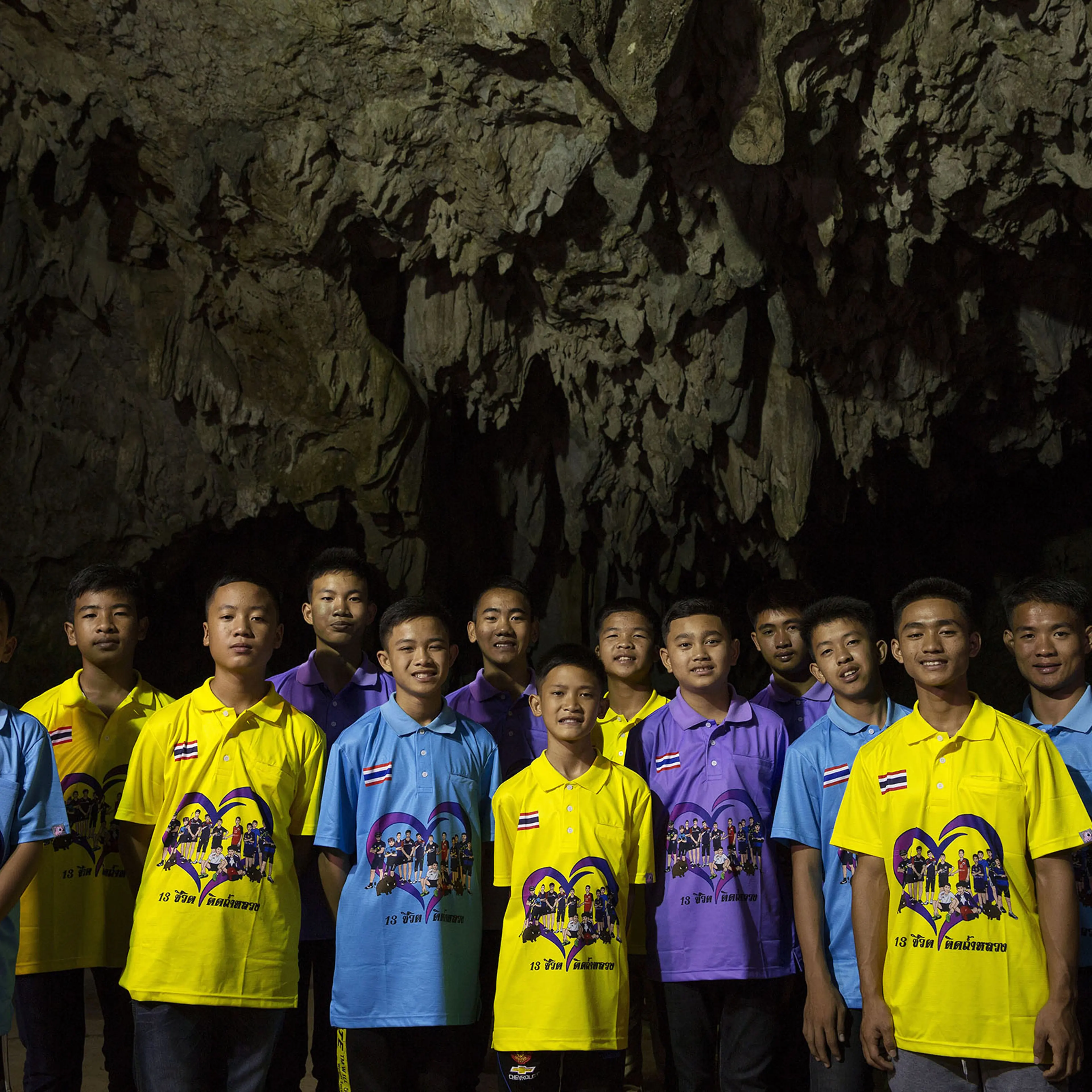 Nearly six months after the rescue, the team poses at the entrance to Tham Luang Cave