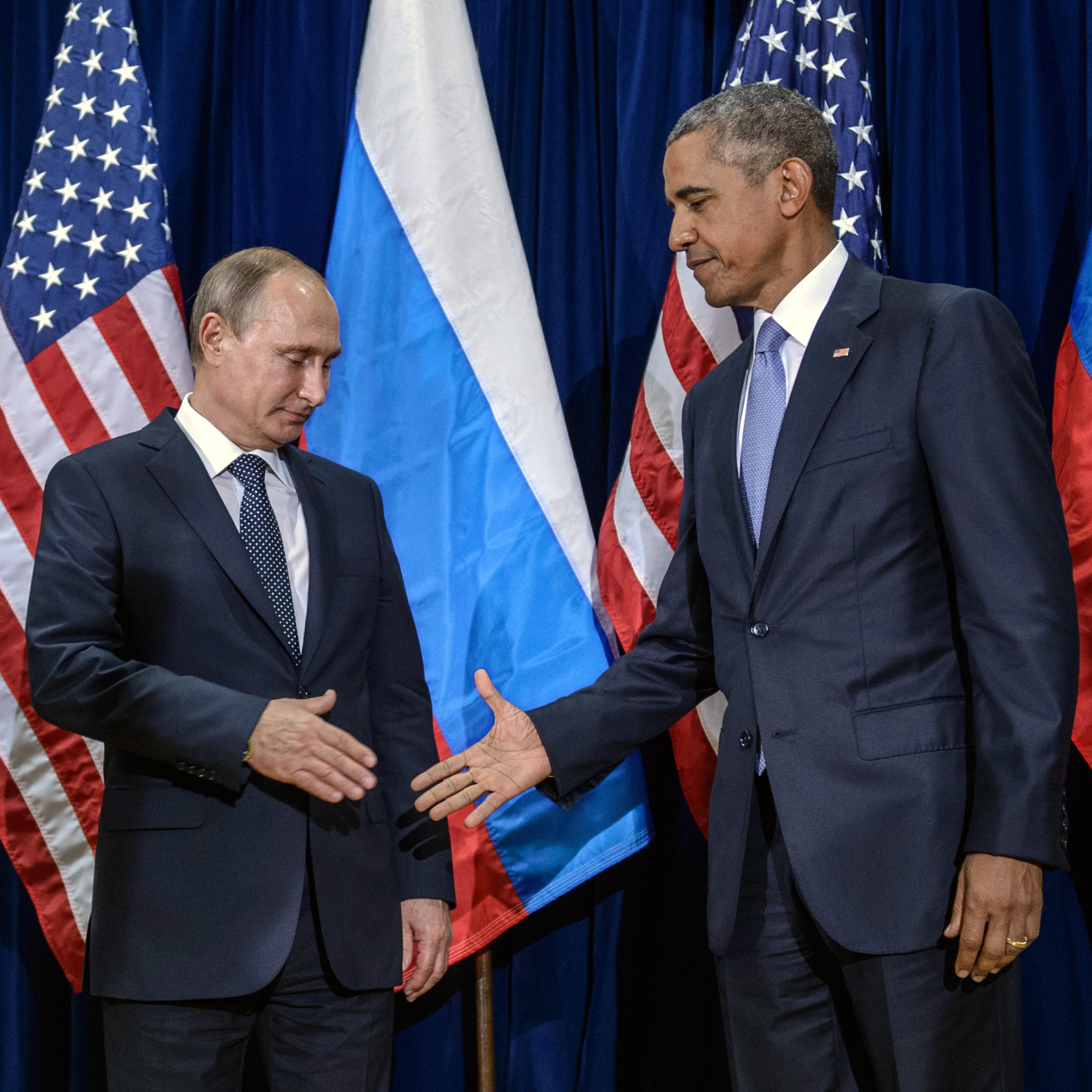 Russian President Vladimir Putin (L) and U.S. President Barack Obama shake hands for the cameras before the start of a bilateral meeting at the United Nations headquarters in New York City on Sept. 28, 2015.