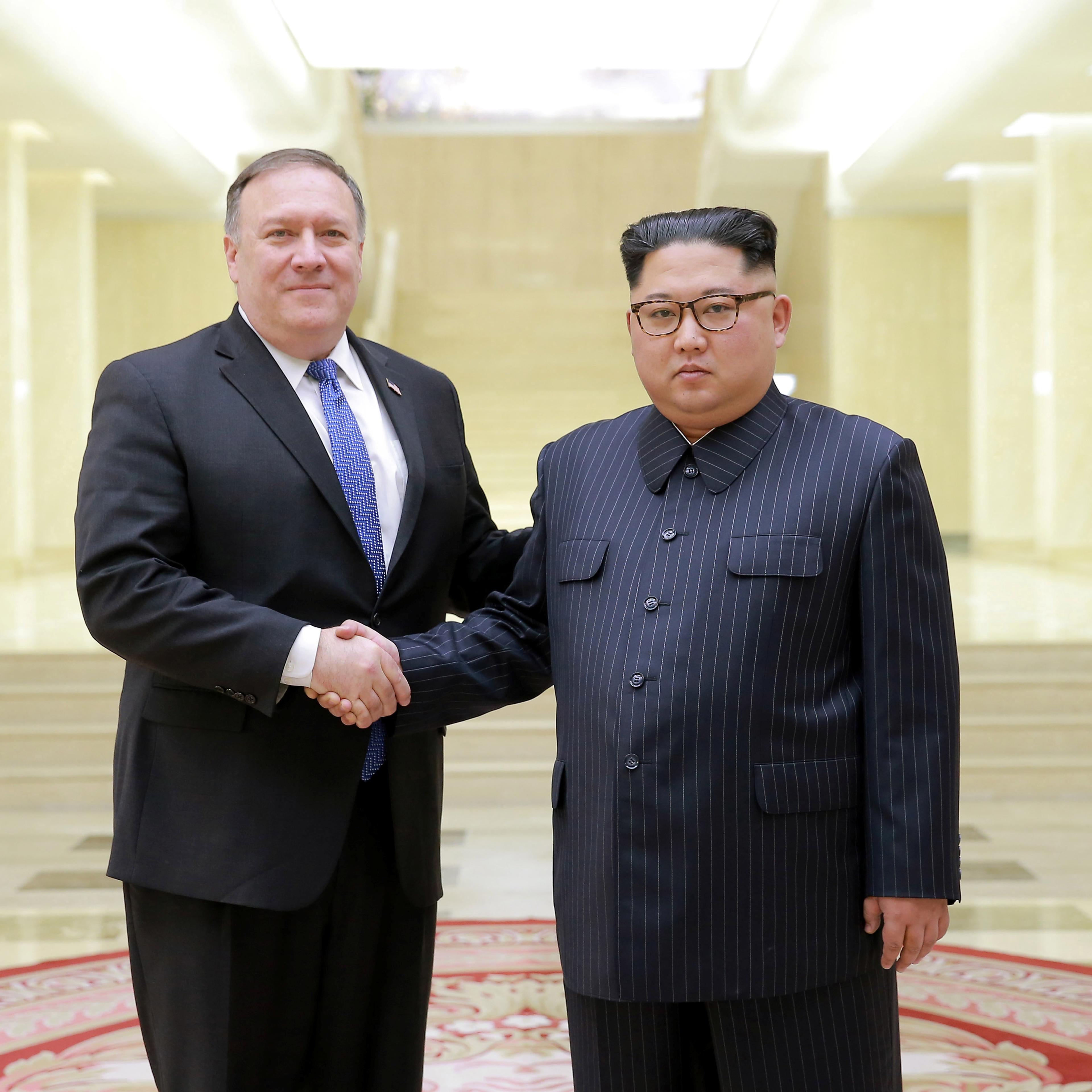 North Korean leader Kim Jong Un shakes hands with U.S. Secretary of State Mike Pompeo