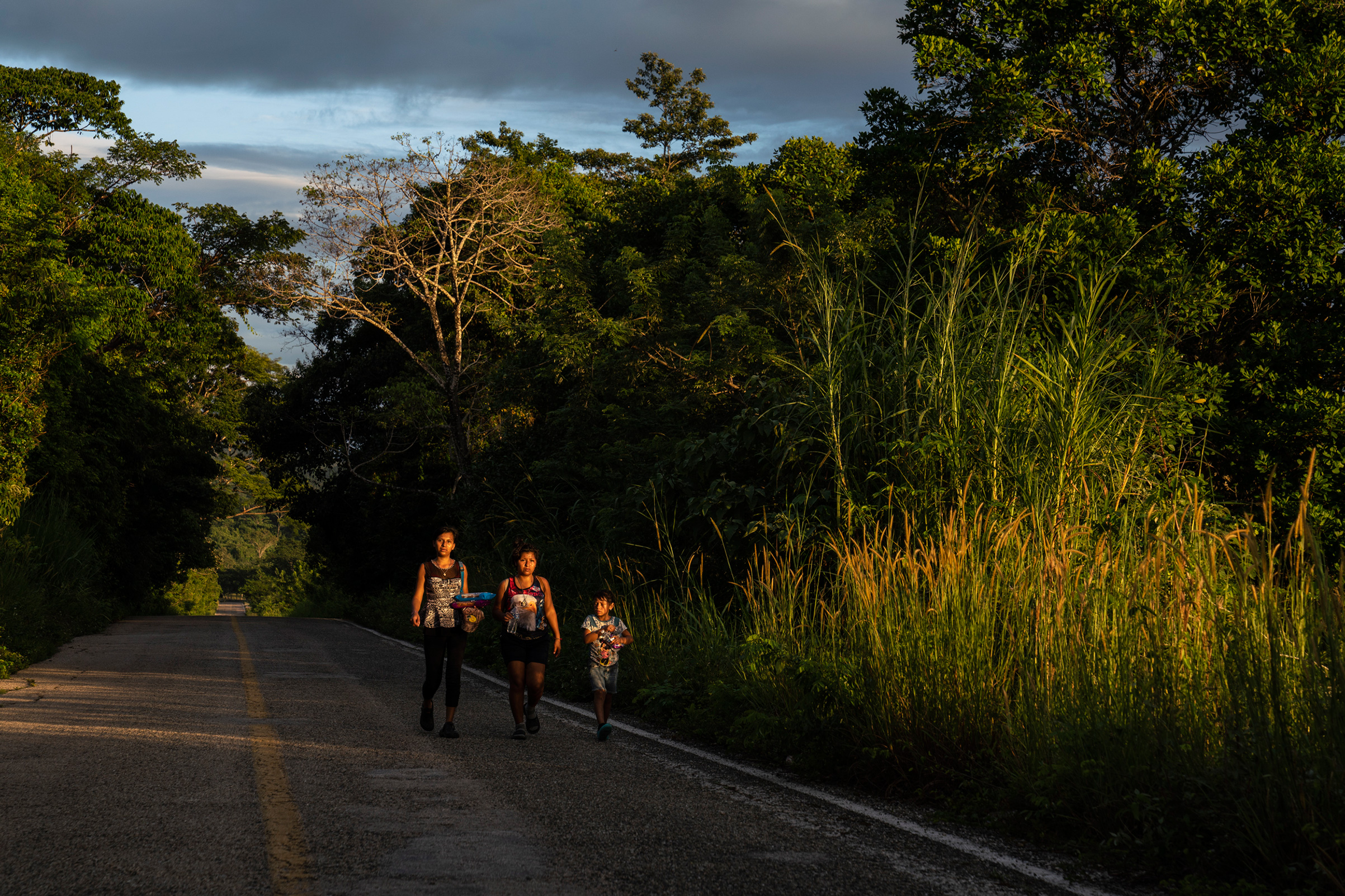 Honduran migrants walk through highway Mxico 307 on Oct. 21 near Palenque, Chiapas. The highway is also known by the locals as ÒEl gran corredor del pacfico del migrante,Ó or ÒThe Great Pacific Corridor of the Migrant. This is a common route for Hondur