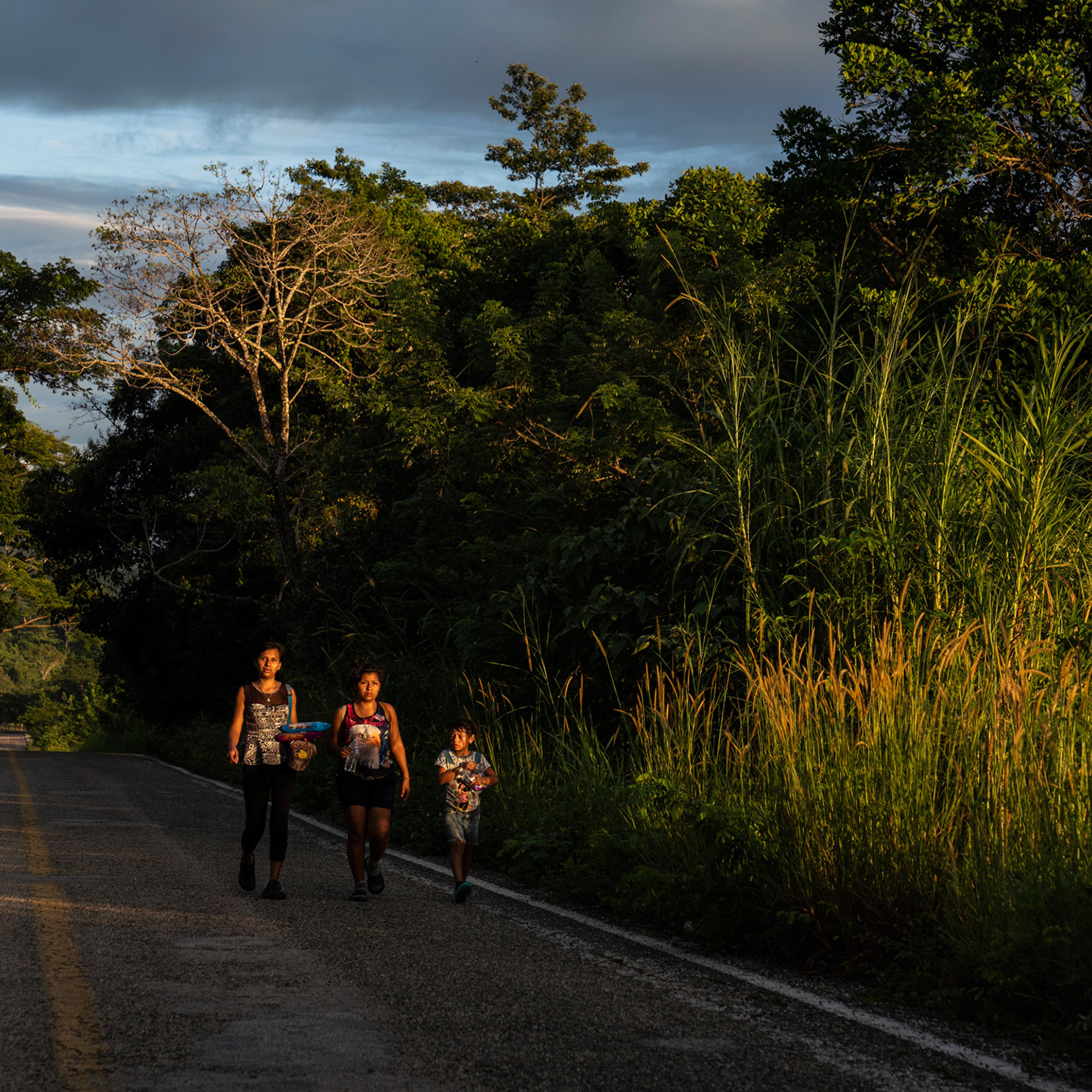 Honduran migrants walk through highway Mxico 307 on Oct. 21 near Palenque, Chiapas. The highway is also known by the locals as ÒEl gran corredor del pacfico del migrante,Ó or ÒThe Great Pacific Corridor of the Migrant. This is a common route for Hondur