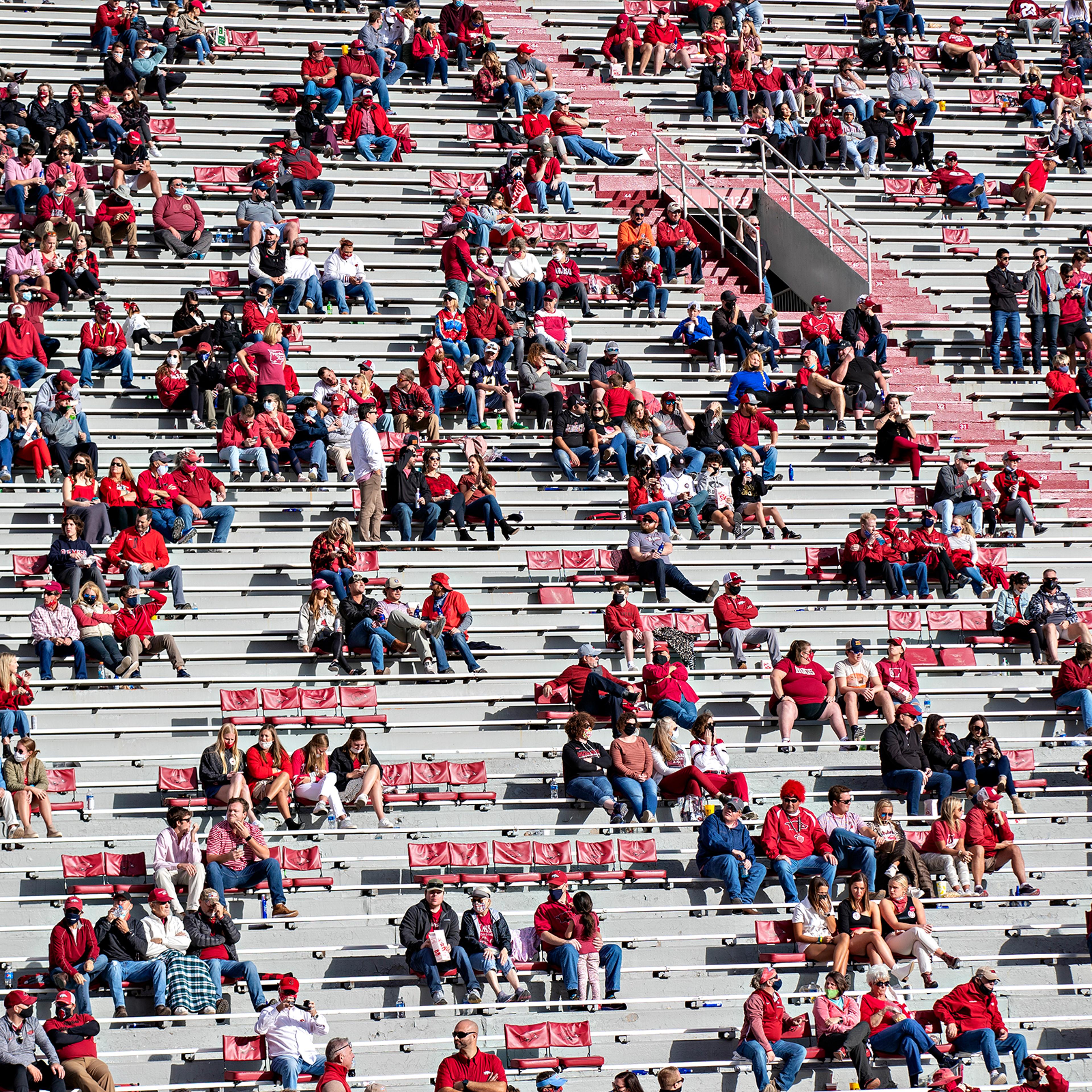 Socially distanced groups of fans during a game between the Arkansas Razorbacks and the Mississippi Rebels in Fayetteville, Ark., on Oct. 17, 2020.