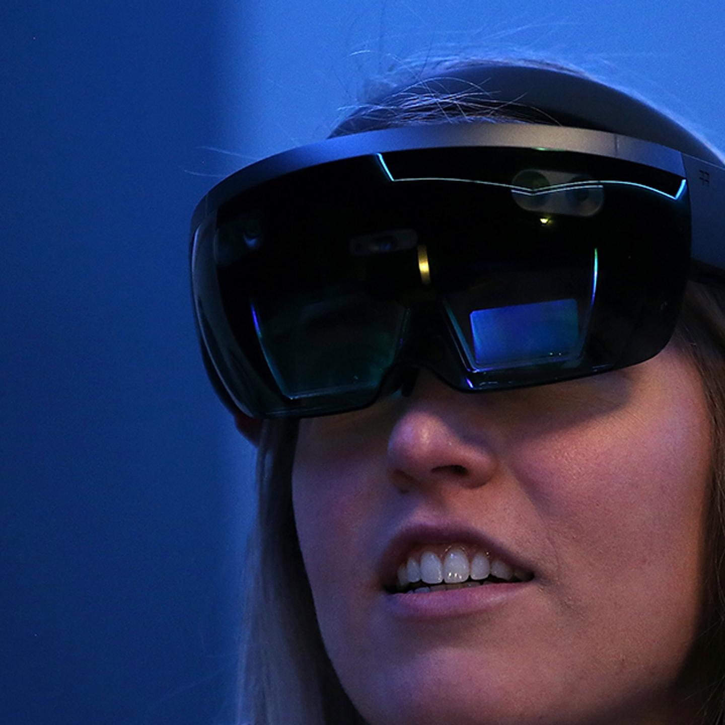 Microsoft employee Gillian Pennington demonstrates the Microsoft HoloLens augmented reality (AR) viewer during the 2016 Microsoft Build Developer Conference on March 30, 2016 in San Francisco, California.