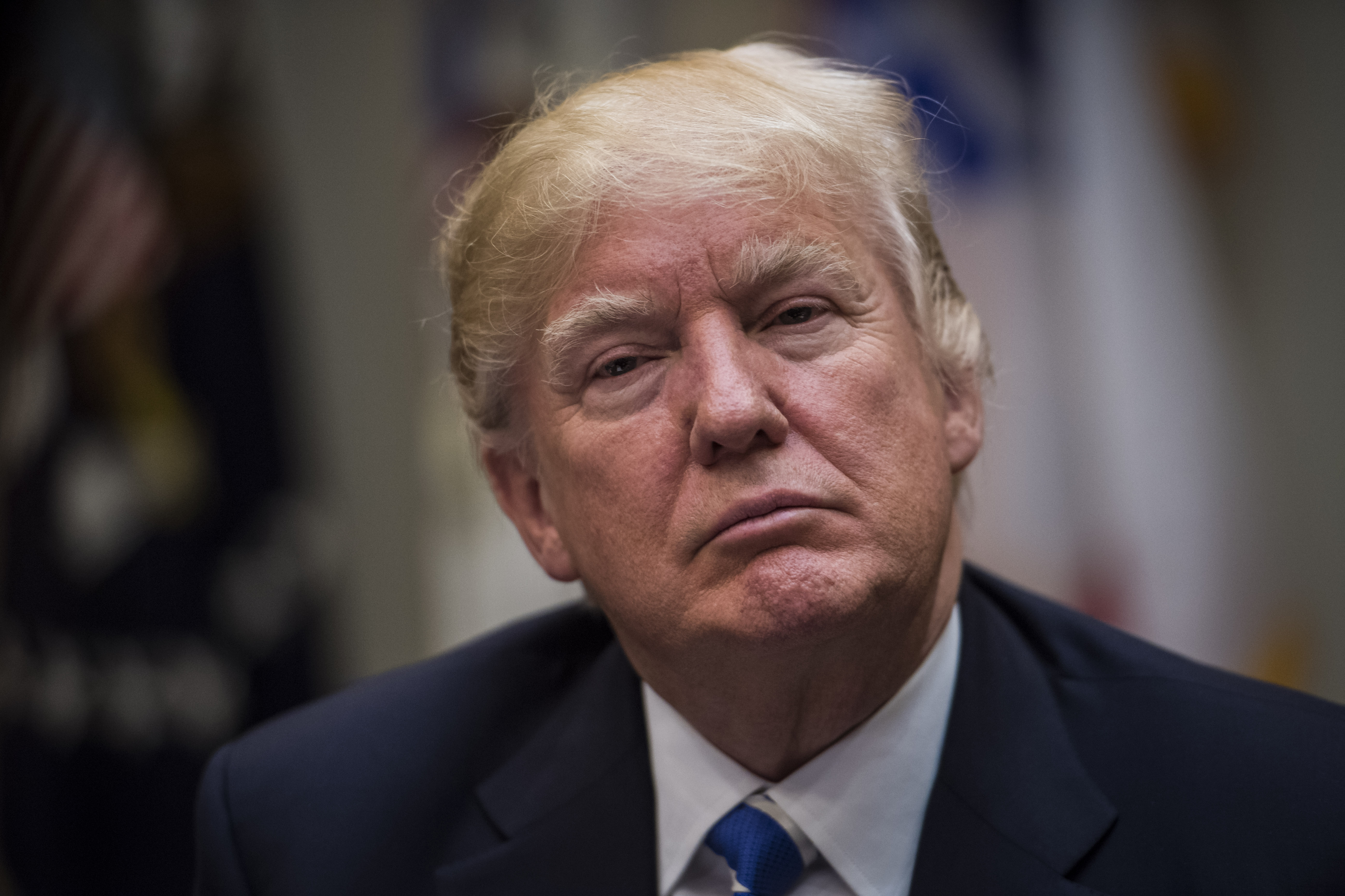 President Donald Trump listens during a meeting with women small business owners in the Roosevelt Room of the White House in Washington, DC on Monday, March. 27, 2017.