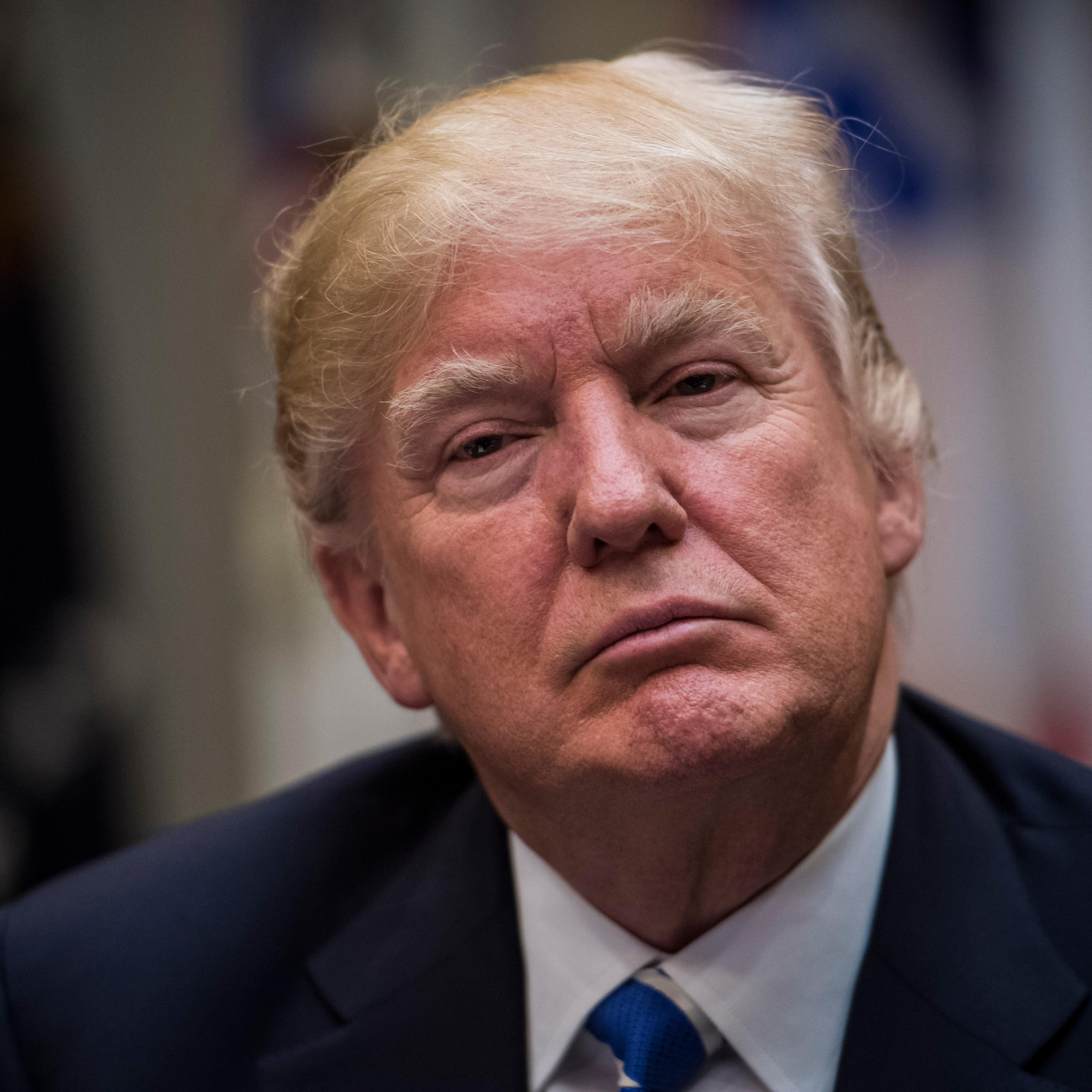 President Donald Trump listens during a meeting with women small business owners in the Roosevelt Room of the White House in Washington, DC on Monday, March. 27, 2017.