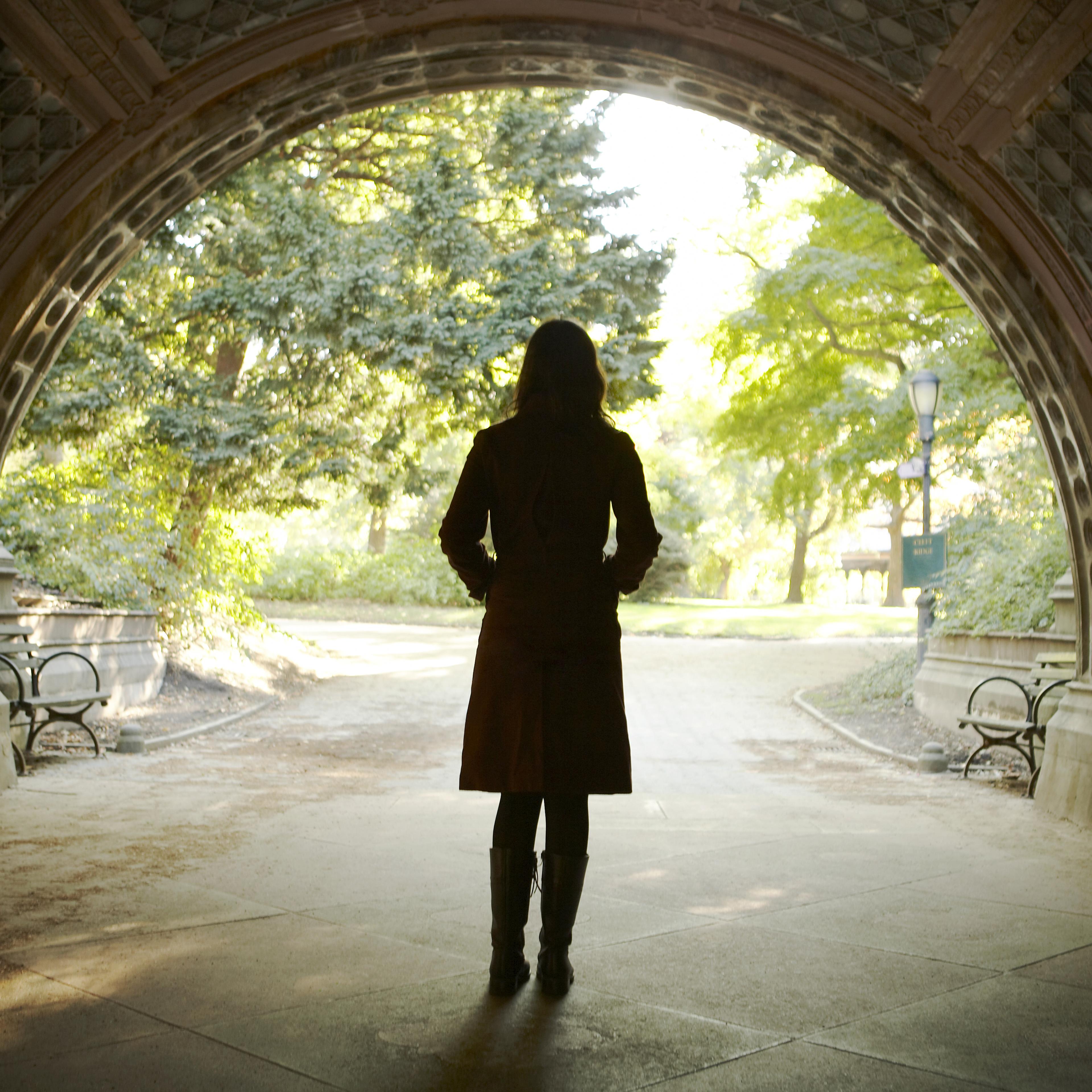 Woman walking college campus