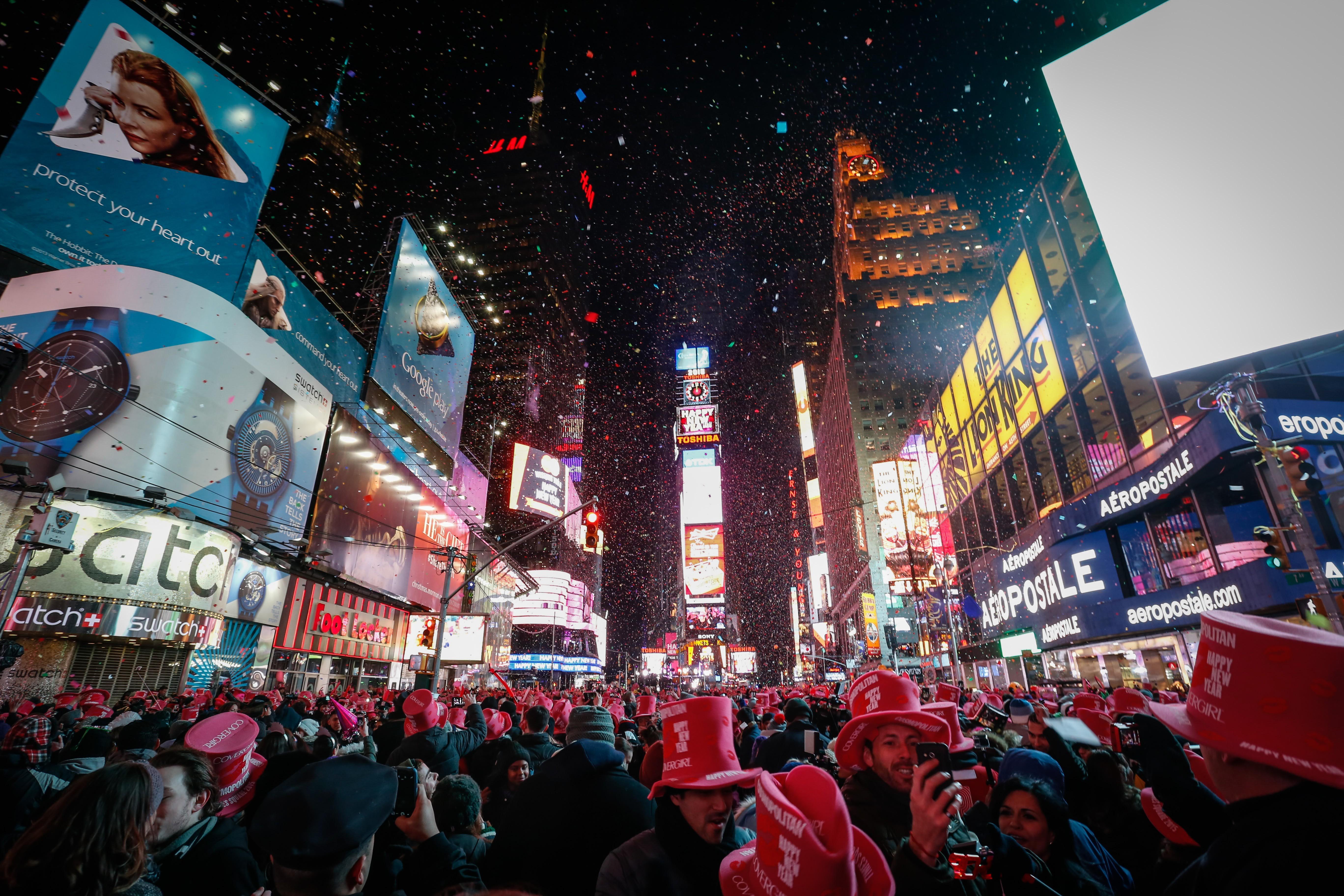 NEW YORK, NY - JANUARY 01: Young revelers cheer on New Year's Eve in New York's Times Square, United States on January 01, 2015. An estimated one million people assembled on New York's Times Square to count down to the New Year. Crowd gathered to watch t