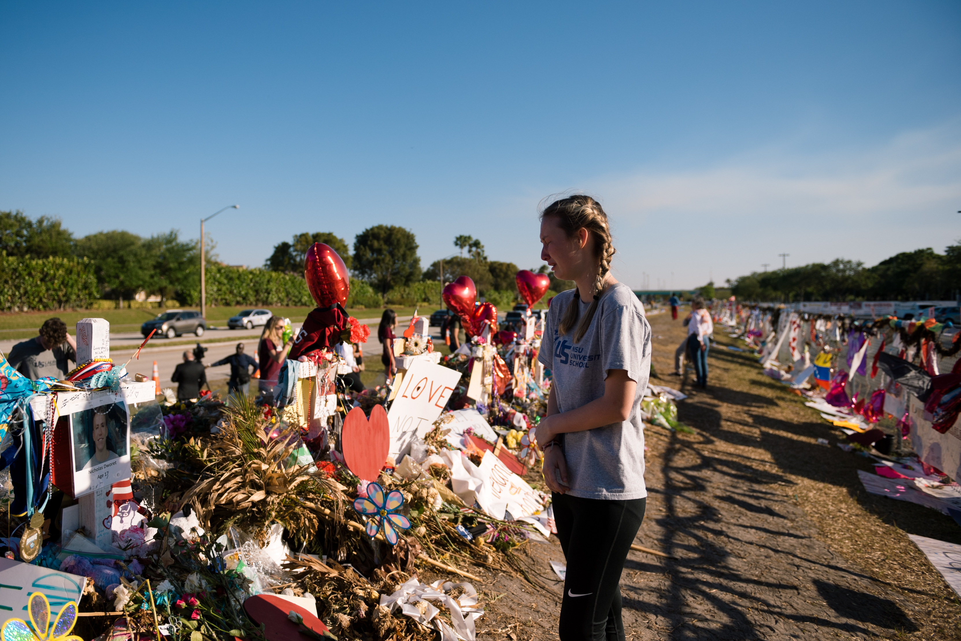 A student visits the memorial site of the 17 lives lost at