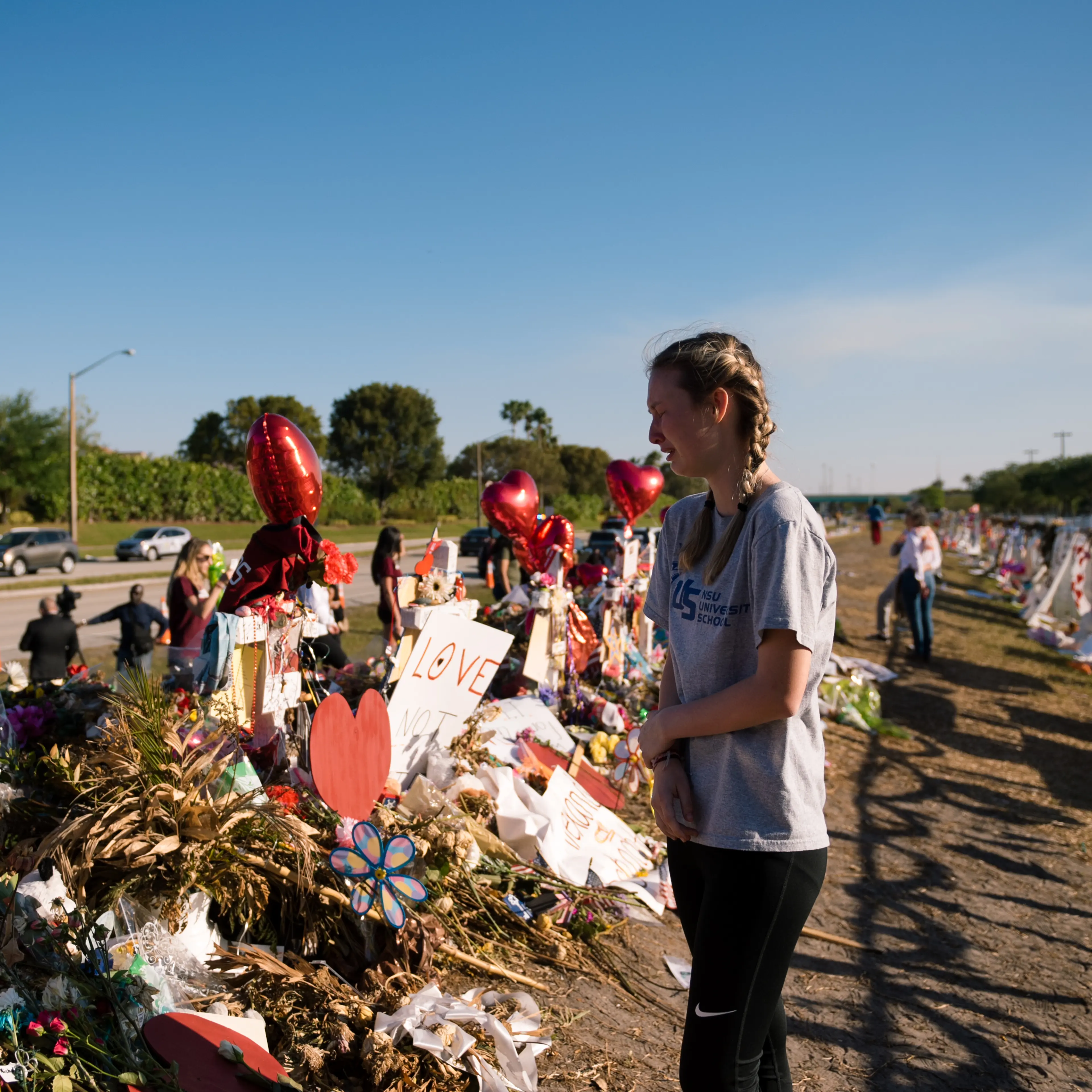 A student visits the memorial site of the 17 lives lost at