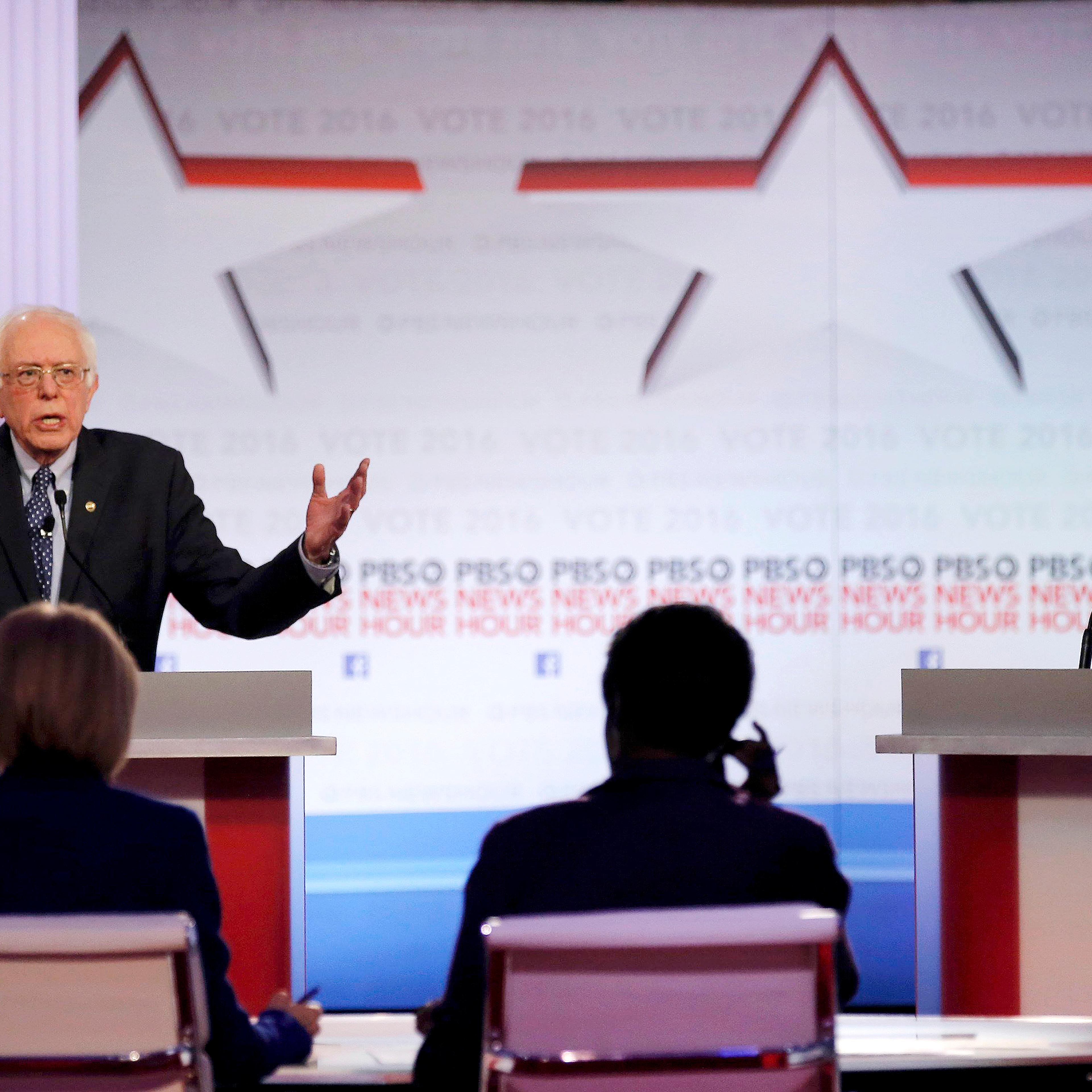 Democratic U.S. presidential candidate Senator Bernie Sanders speaks as former Secretary of State Hillary Clinton listens at the PBS NewsHour Democratic presidential candidates debate in Milwaukee