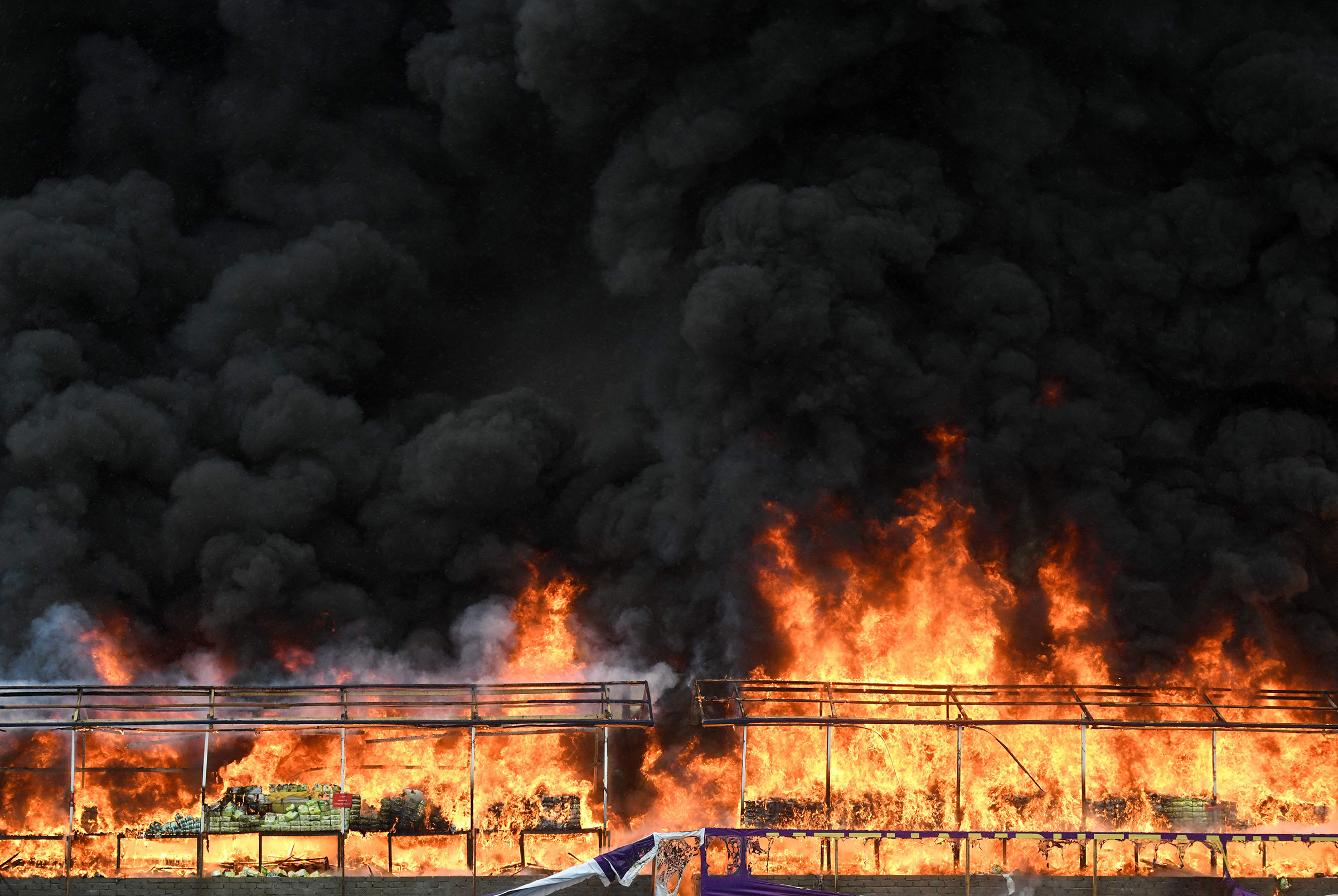A burning pile of seized illegal drugs is seen during a destruction ceremony to mark the "International Day against Drug Abuse and Illicit Trafficking" in Yangon on June 26, 2023.