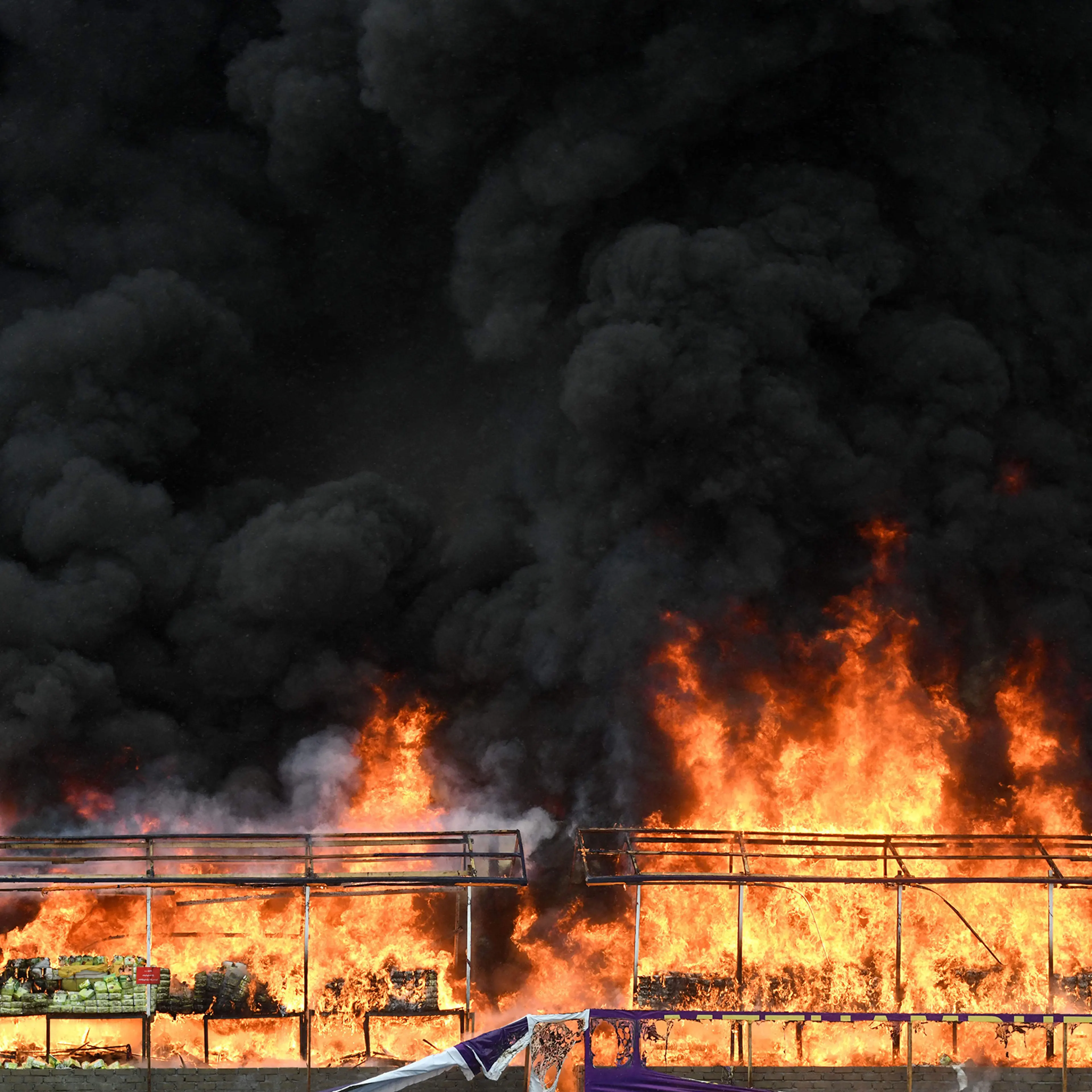 A burning pile of seized illegal drugs is seen during a destruction ceremony to mark the "International Day against Drug Abuse and Illicit Trafficking" in Yangon on June 26, 2023.