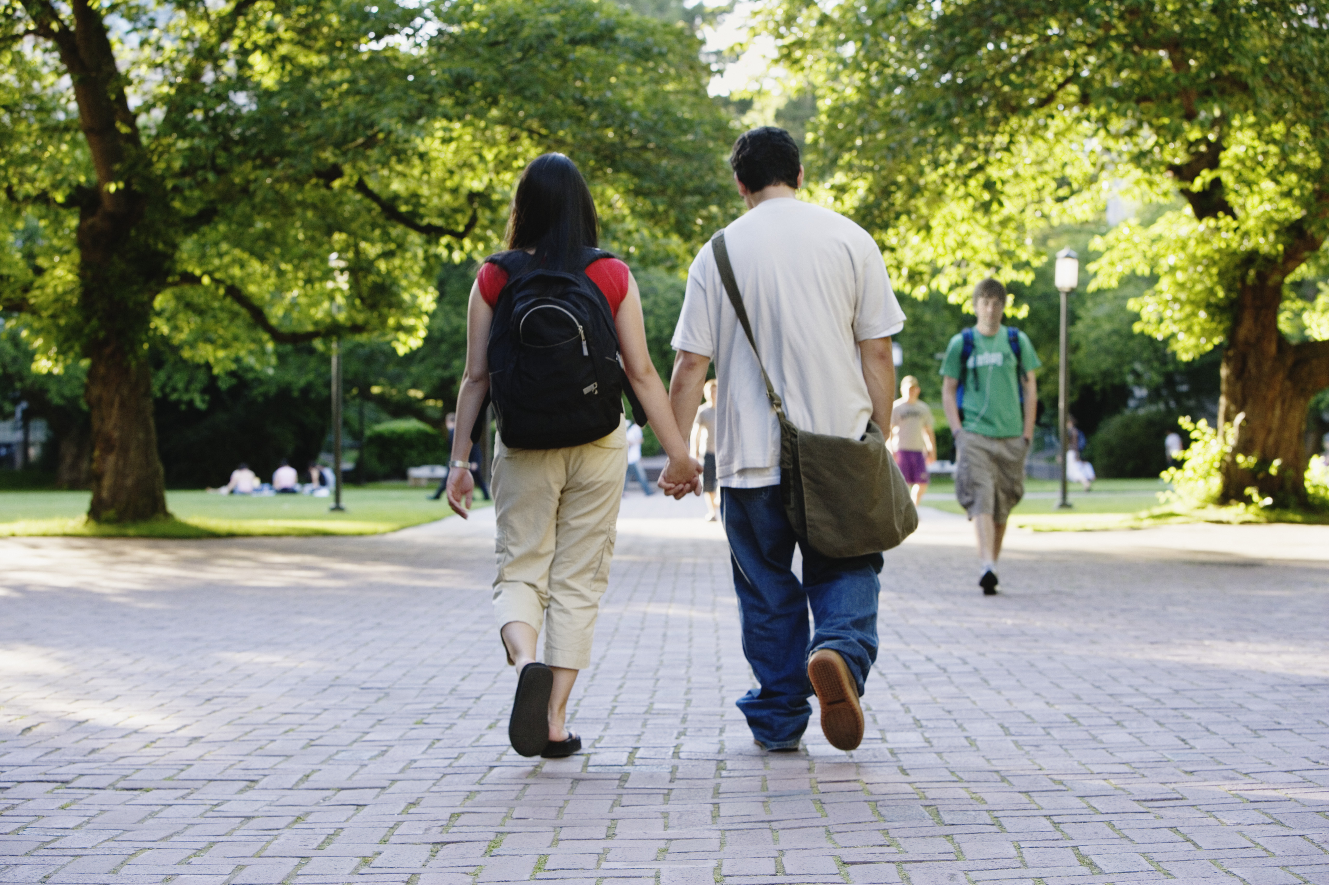 Couple walking outside holding hands