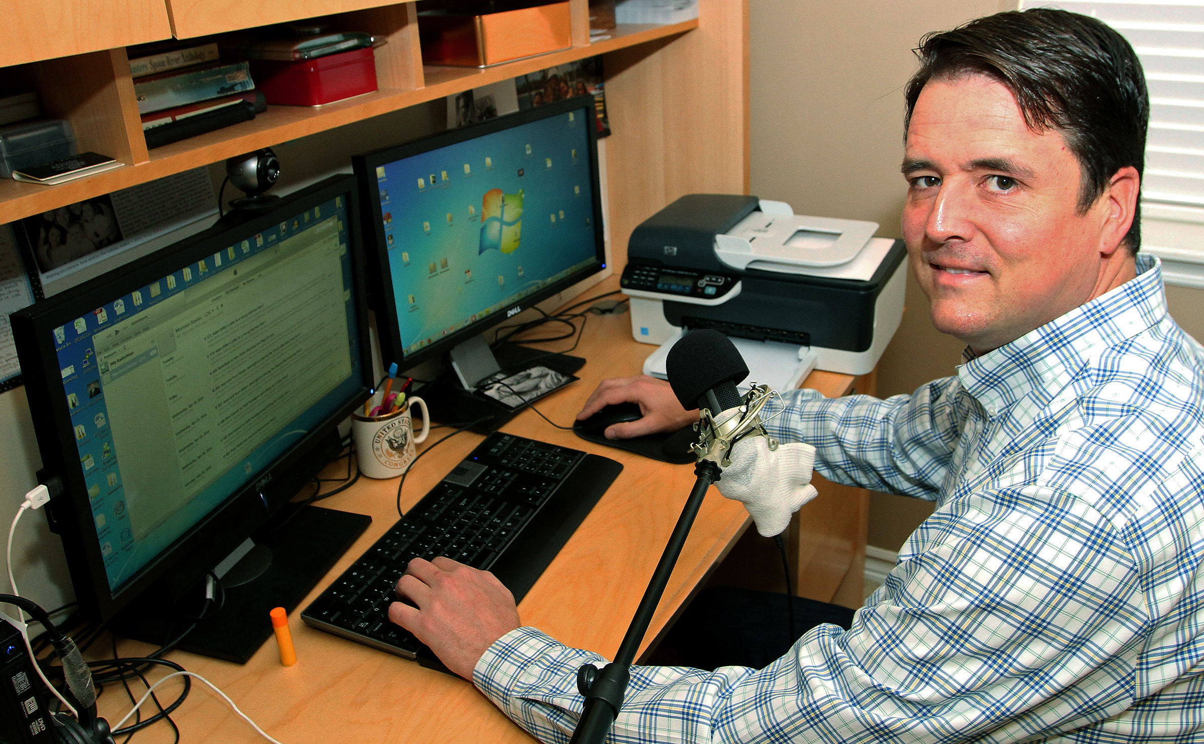 John Dehlin sits in his basement studio where he broadcasts his podcast at his home in North Logan, Utah on May 16, 2014.