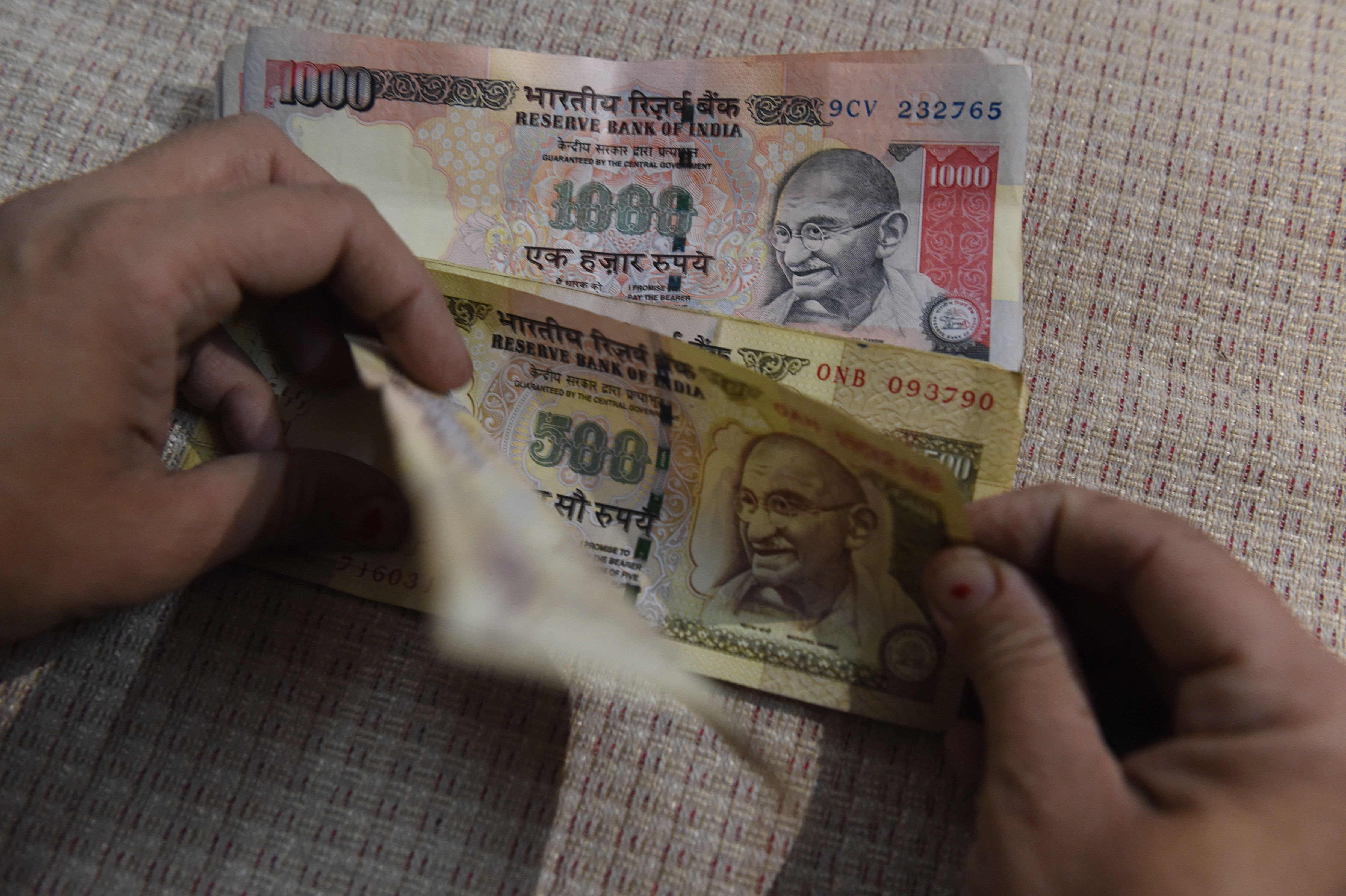 INDIA-POLITICS-CURRENCY