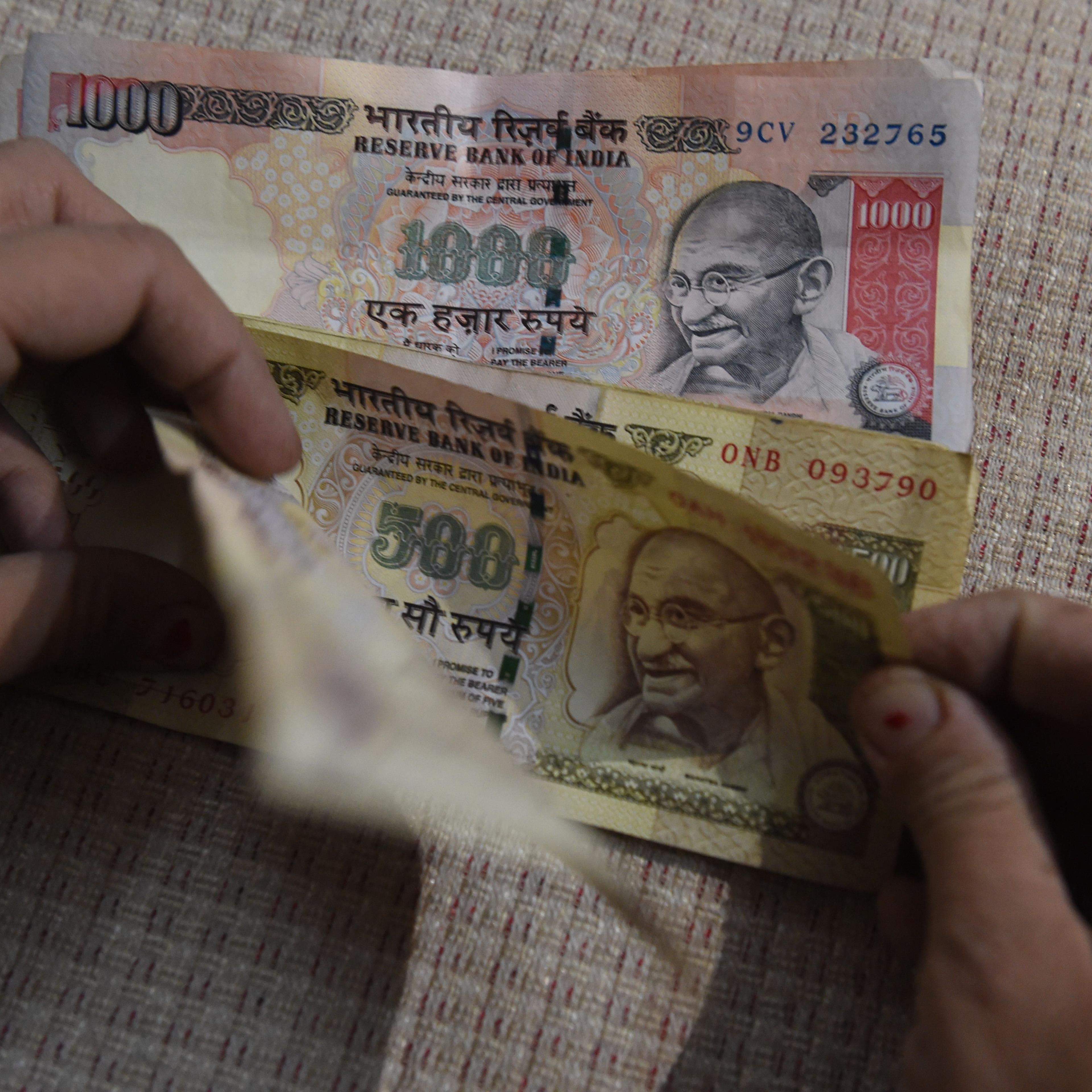 INDIA-POLITICS-CURRENCY