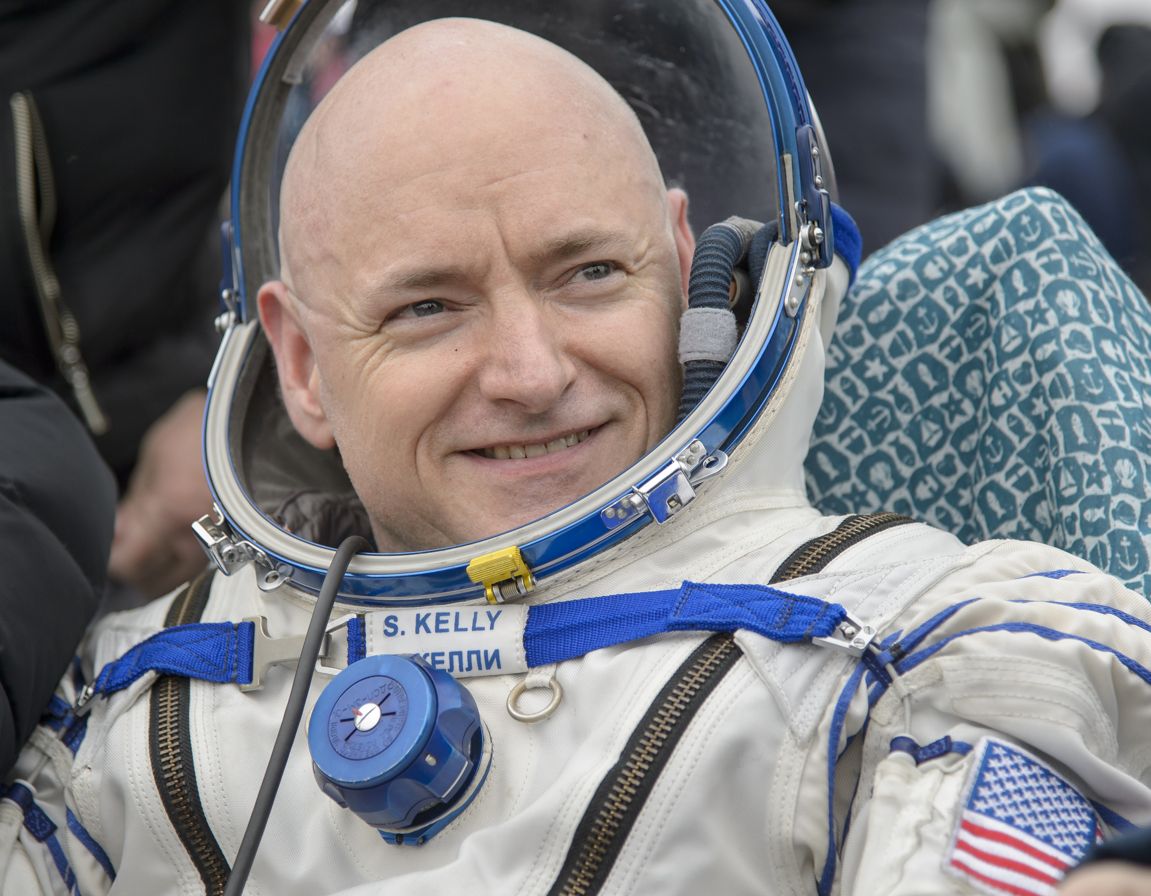 Expedition 46 Commander Scott Kelly of NASA rest in a chair outside of the Soyuz TMA-18M spacecraft just minutes after he and Russian cosmonauts Mikhail Kornienko and Sergey Volkov of Roscosmos landed in a remote area near the town of Zhezkazgan, Kazakhs
