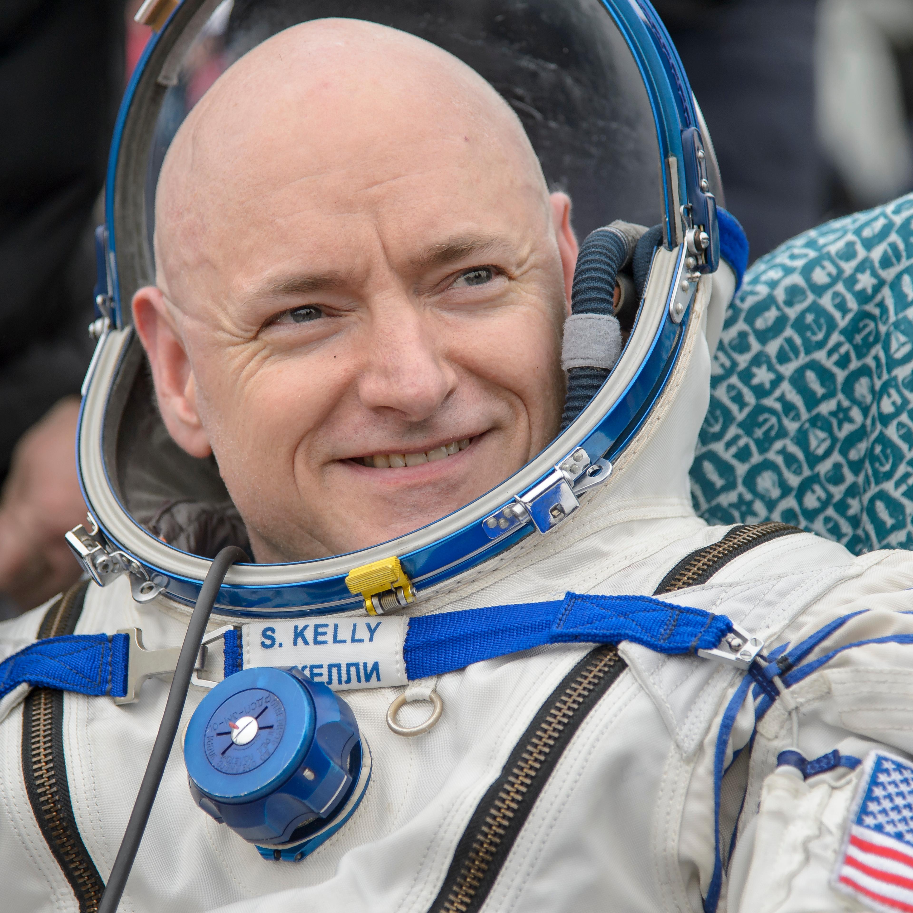 Expedition 46 Commander Scott Kelly of NASA rest in a chair outside of the Soyuz TMA-18M spacecraft just minutes after he and Russian cosmonauts Mikhail Kornienko and Sergey Volkov of Roscosmos landed in a remote area near the town of Zhezkazgan, Kazakhs