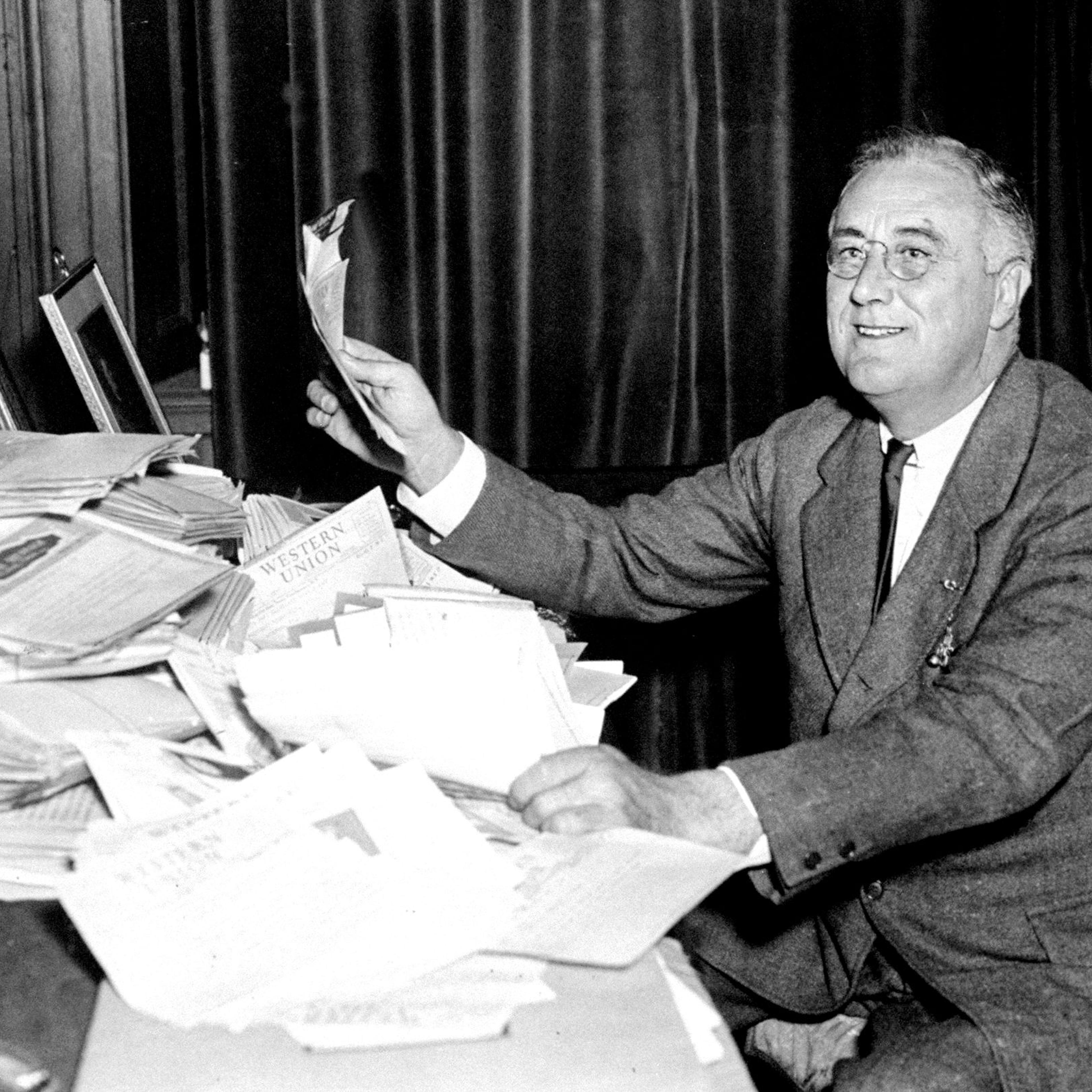 President Franklin D. Roosevelt reads congratulatory telegra