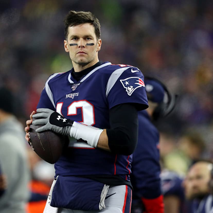 Tom Brady of the New England Patriots looks on from the sideline during the the AFC Wild Card Playoff game against the Tennessee Titans at Gillette Stadium in Foxborough, Mass., on Jan. 04, 2020.